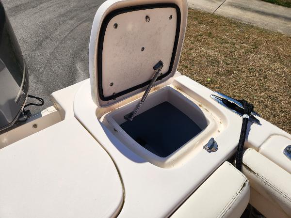 2015 Grady-White Freedom 275 boat storage compartment open, showing interior details.
