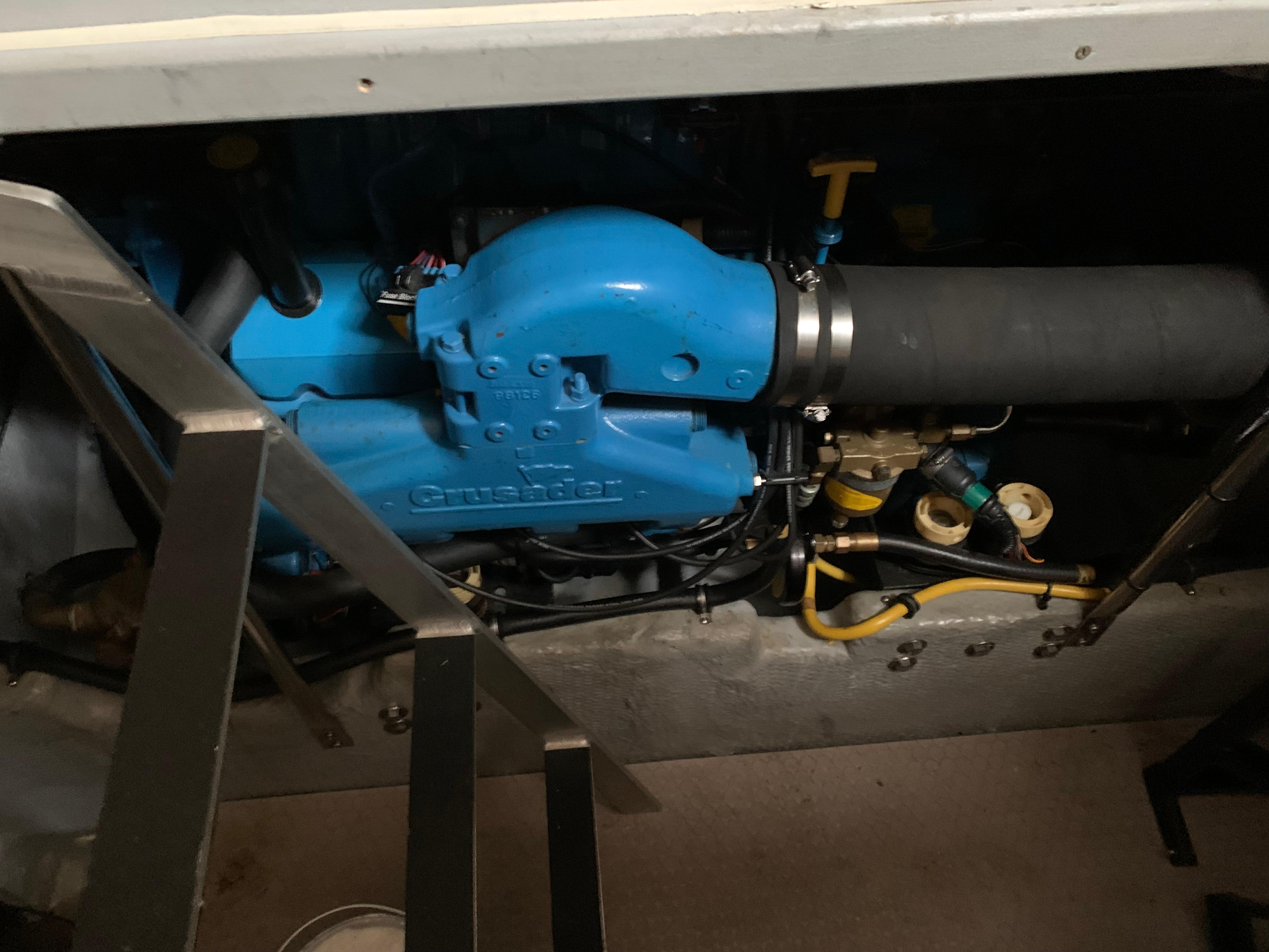 Engine compartment of a 2000 Silverton 392 Motor Yacht, featuring a blue engine component.