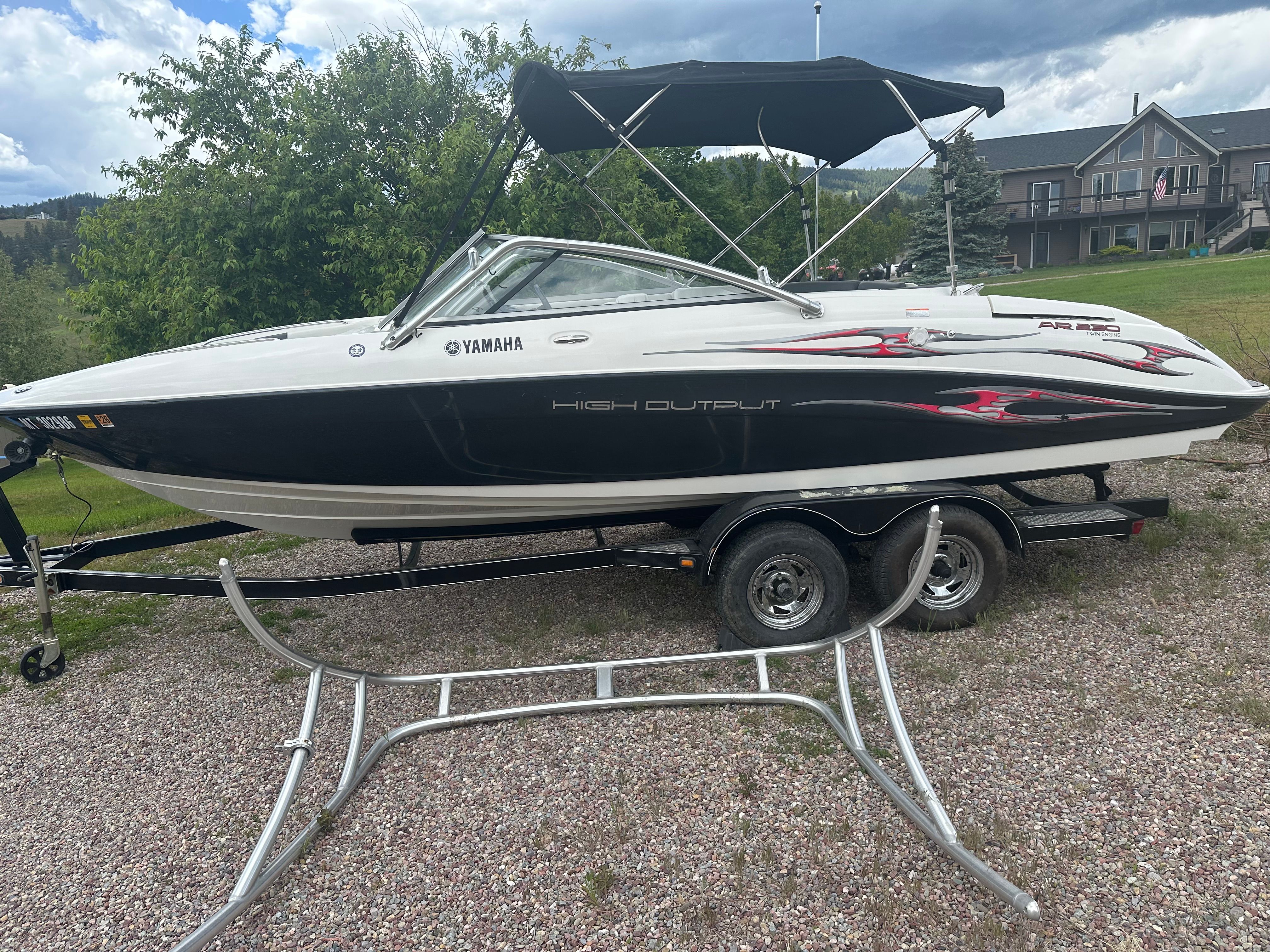 2005 Yamaha AR230 HO boat on trailer parked outdoors.