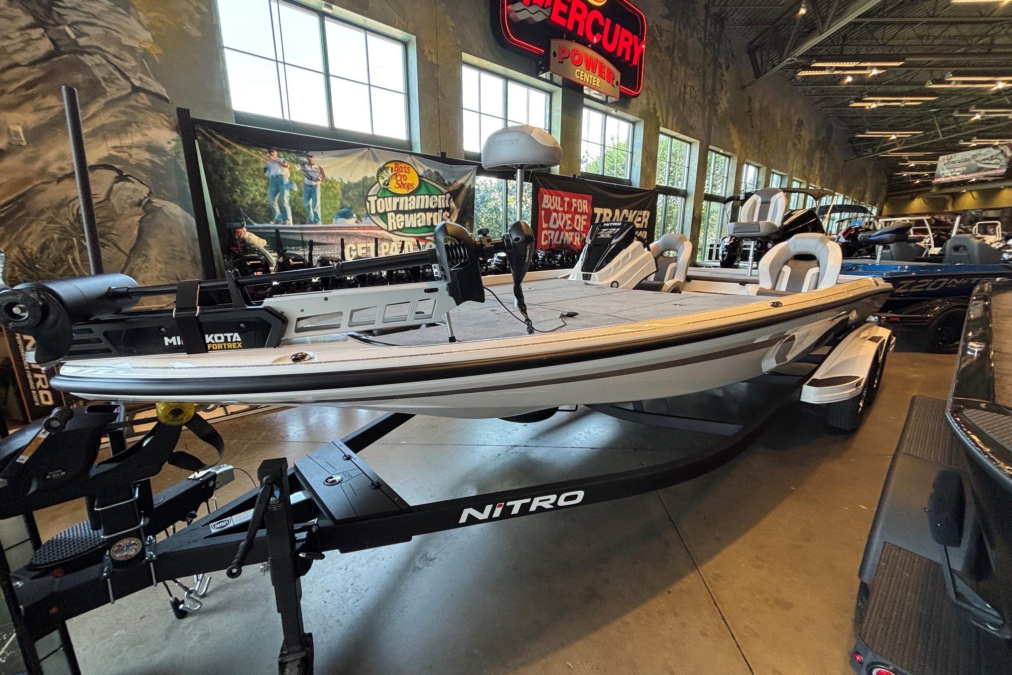 2026 Nitro Z21 XL boat displayed indoors with fishing equipment.