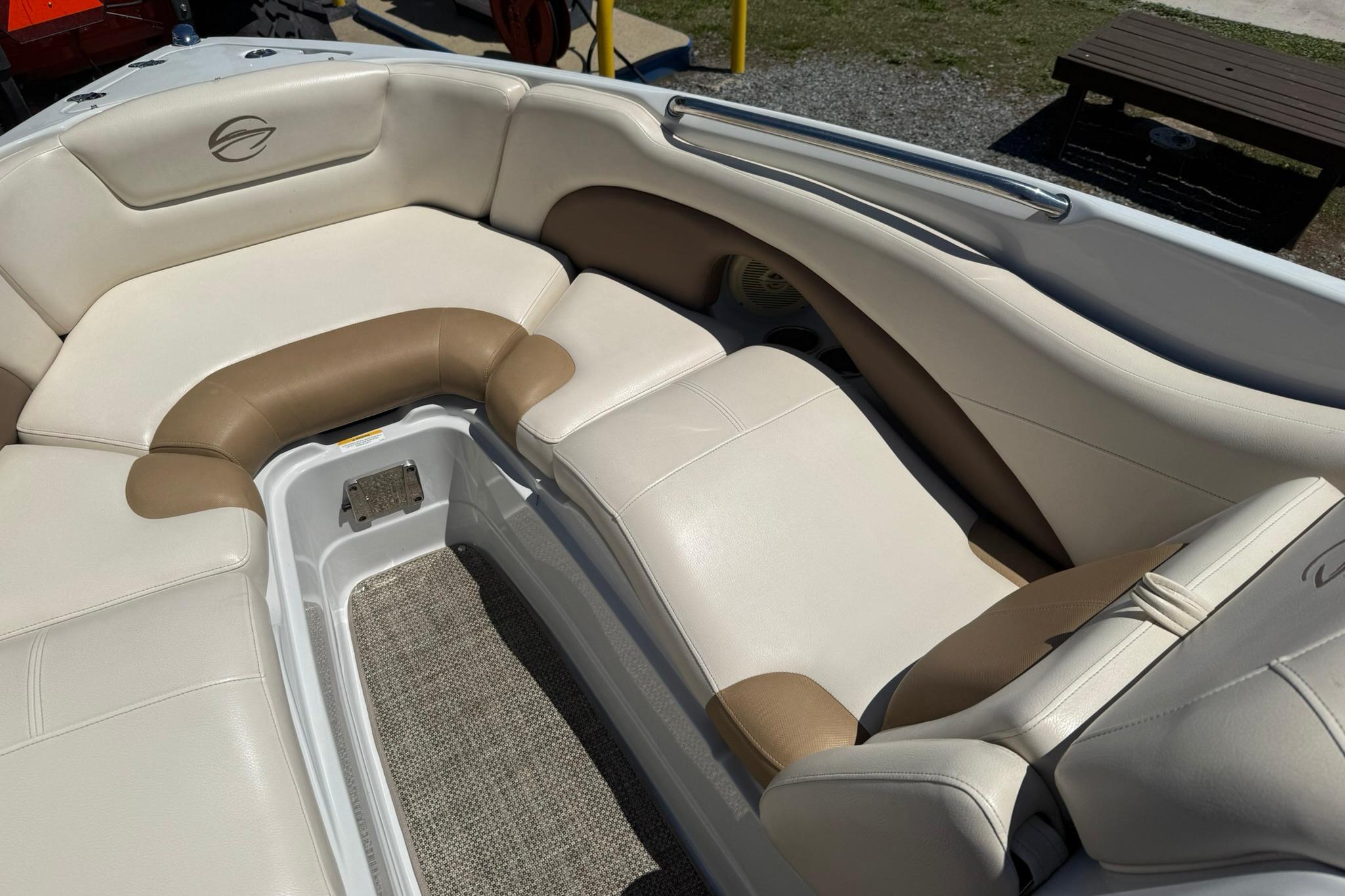 2016 Crownline 255 SS boat interior with beige and brown seating.