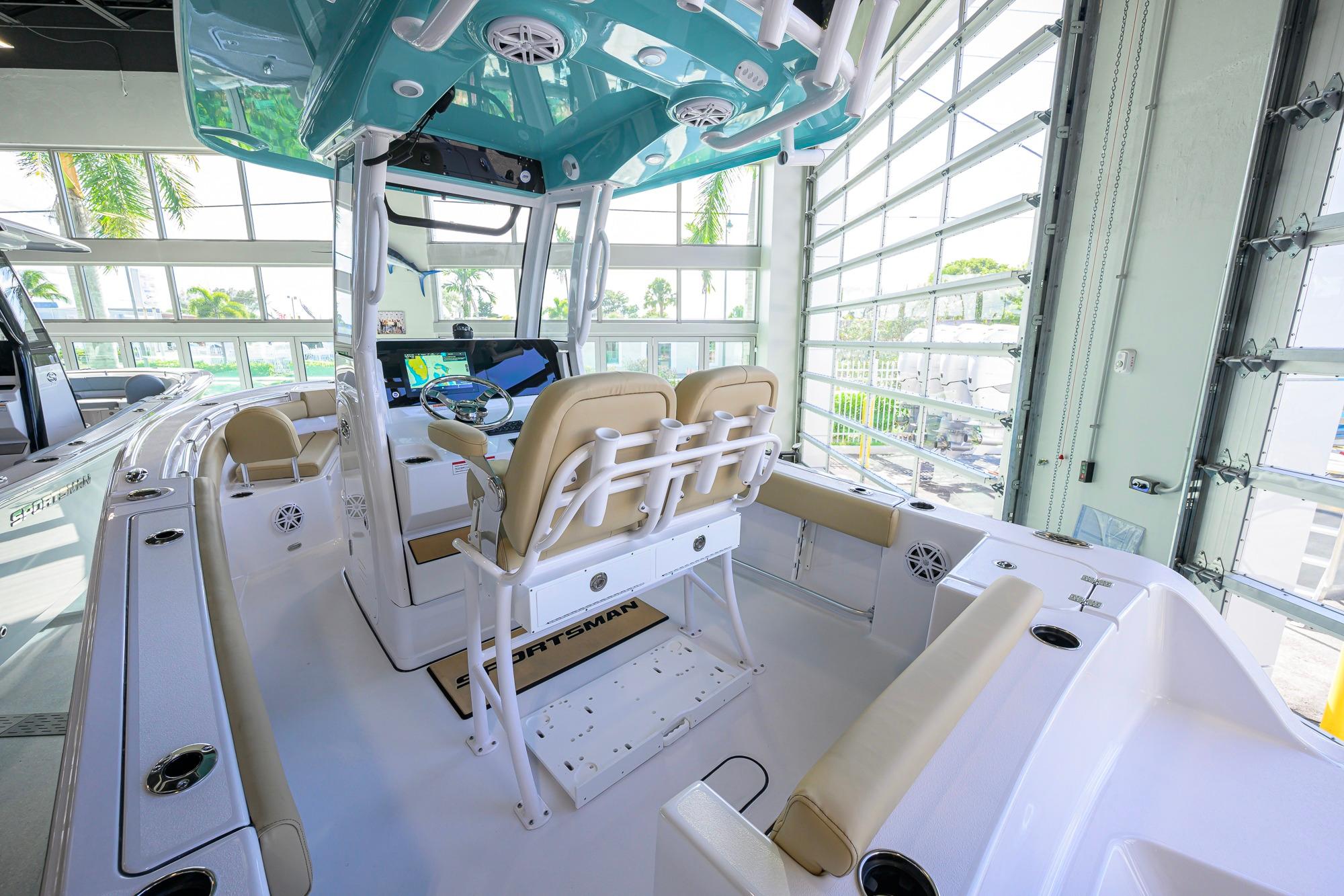 2026 Sportsman Open 212 Center Console boat interior with beige seating and modern controls.