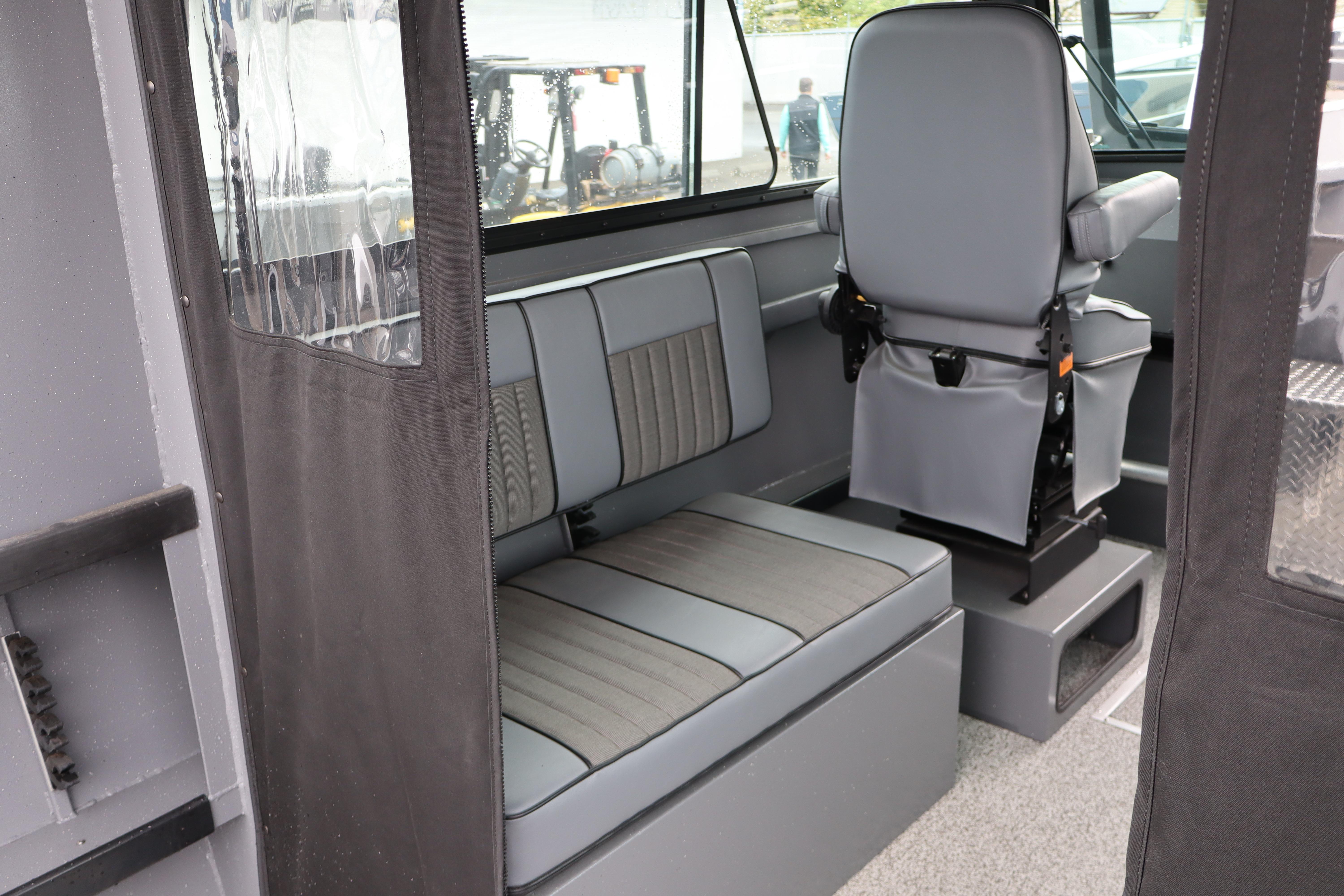 Interior of 2026 Alumaweld Horizon 24 boat with gray seating and modern design.