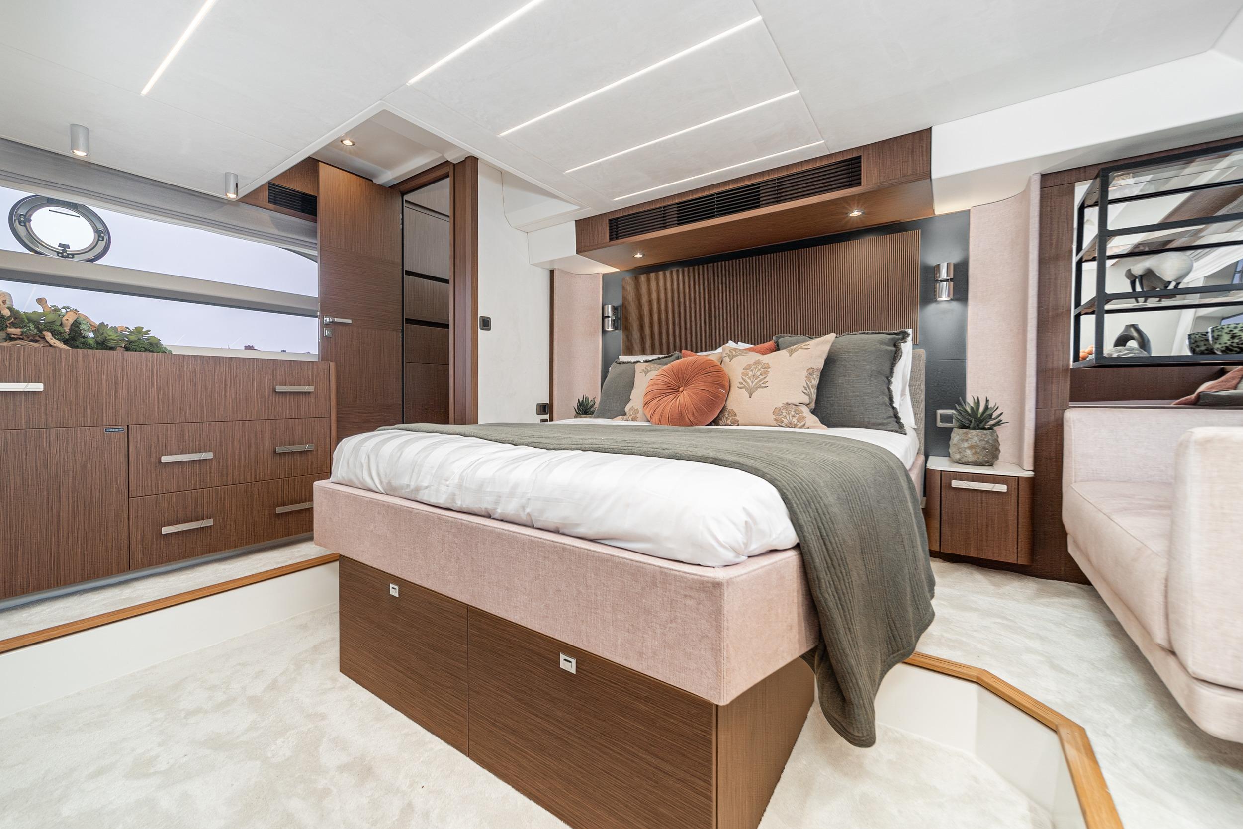 Luxurious 2024 Prestige X60 yacht bedroom with modern design and elegant decor.