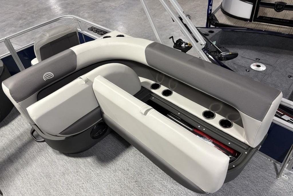 2026 Sun Tracker Bass Buggy 18 DLX boat interior with cushioned seating and cup holders.