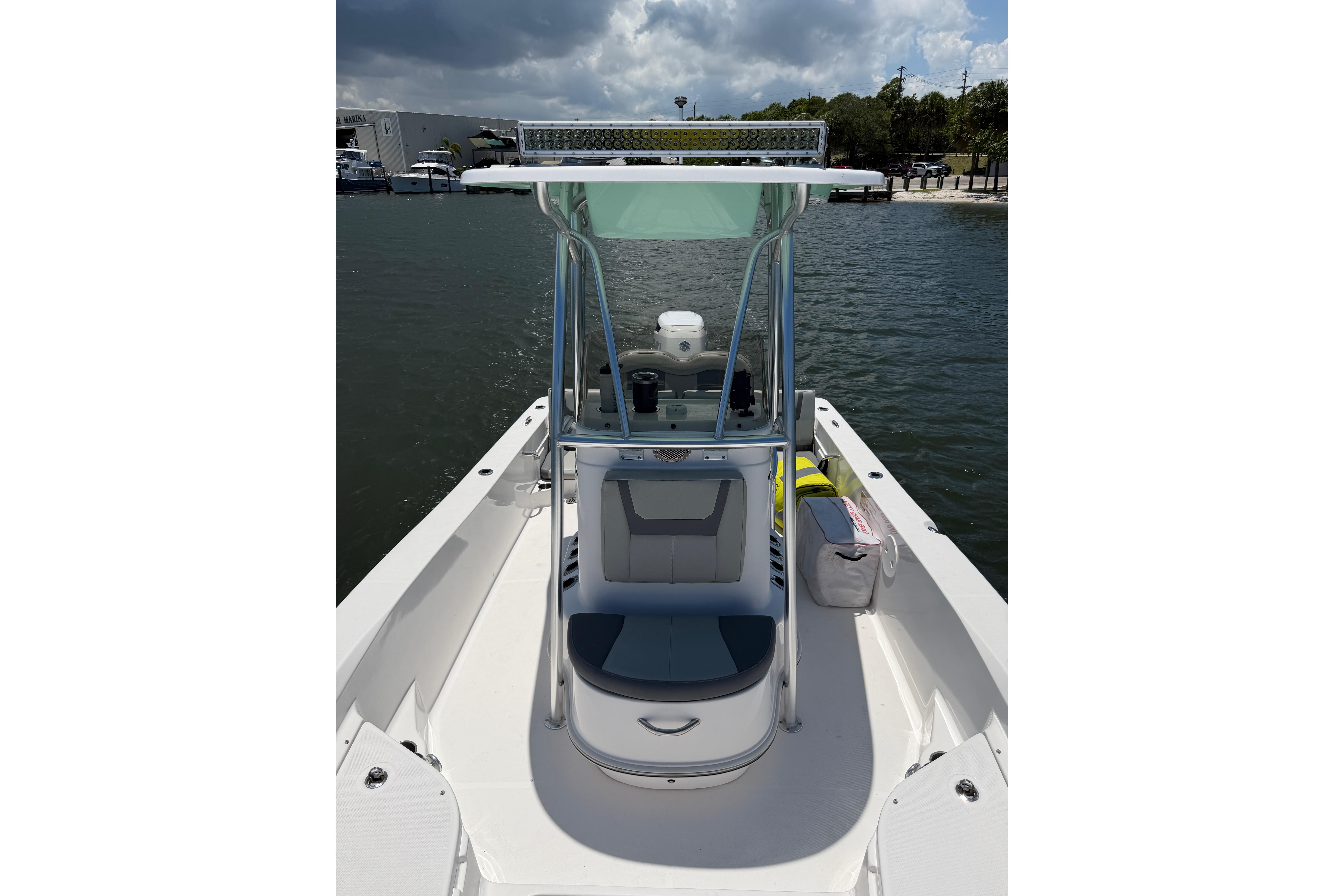 2022 Aquasport 230 Pro Bay boat on water, featuring sleek design and modern amenities.