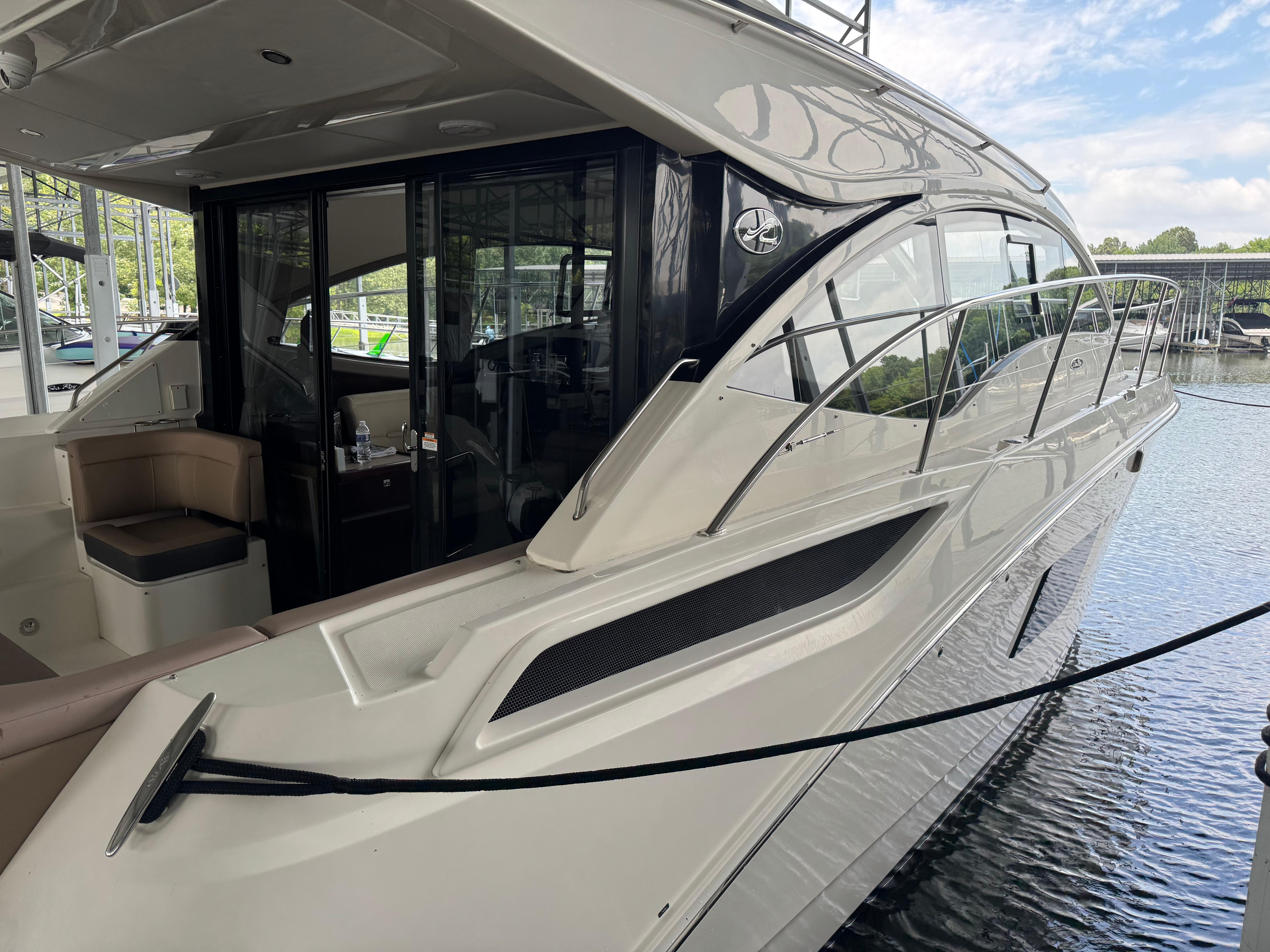 2017 Sea Ray Sundancer 400 yacht docked, showcasing sleek design and luxurious interior.