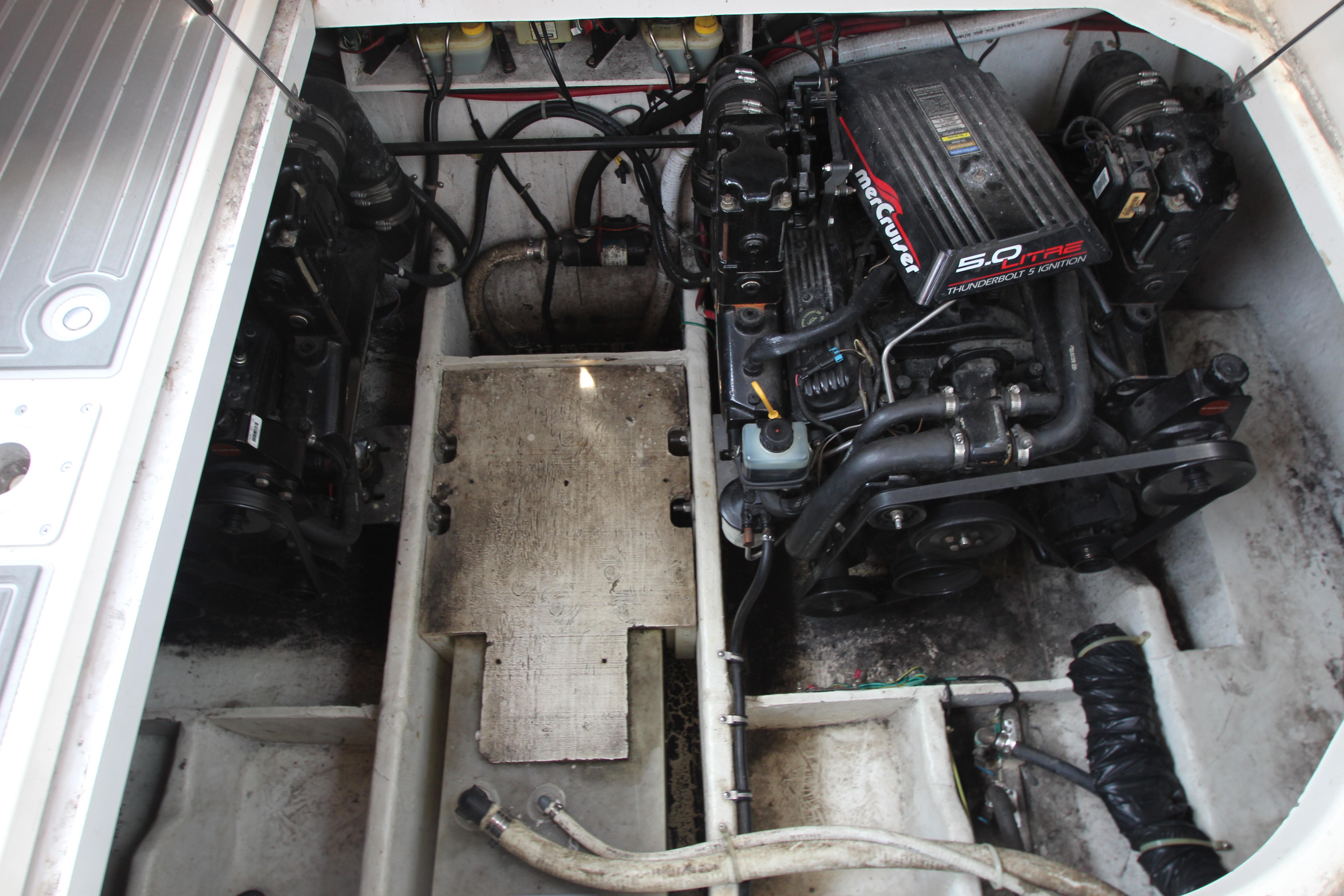 Engine compartment of a 1999 Bayliner 3055 Ciera with MerCruiser 5.0L engine.