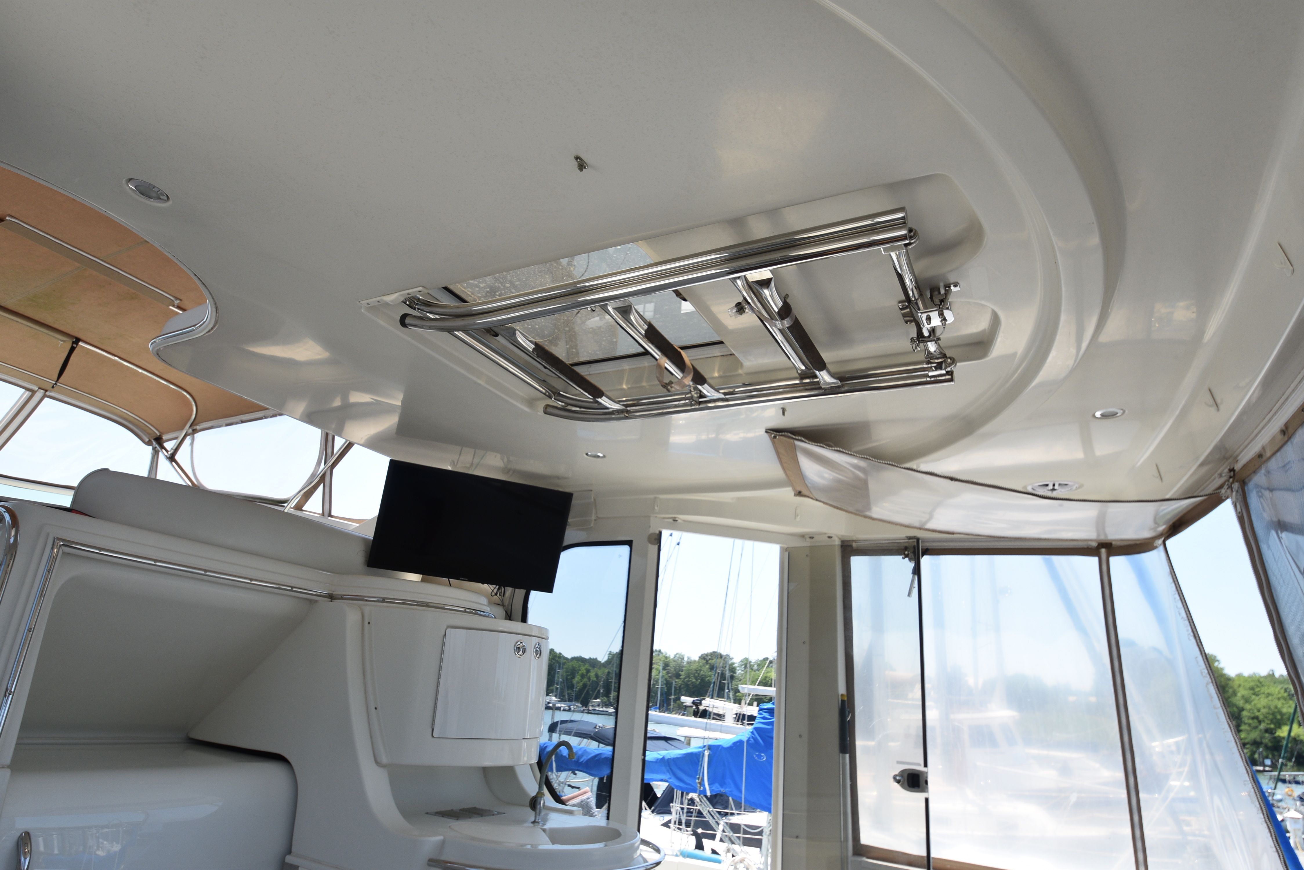 Interior of a 2004 Carver 466 Motor Yacht with TV and windows.