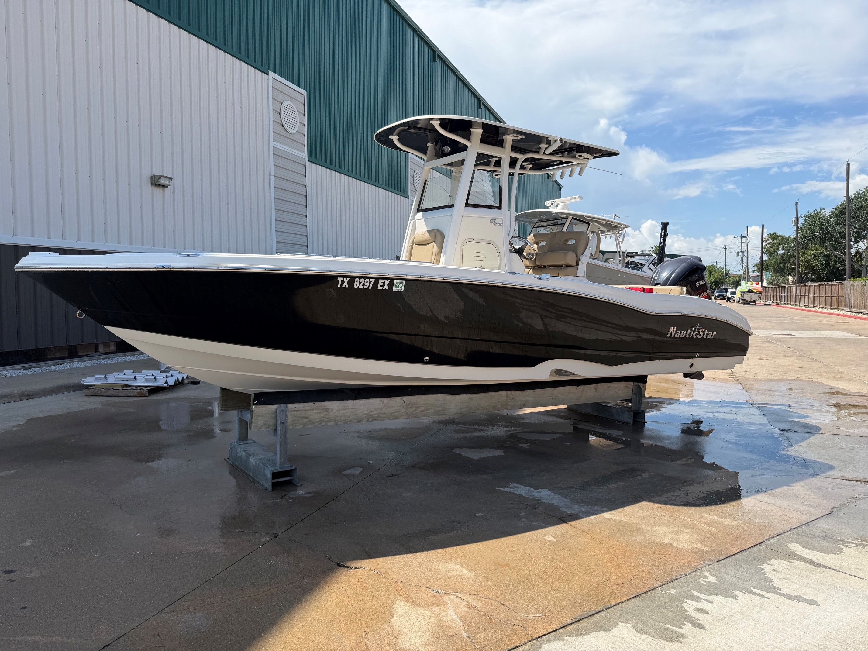 2019 NauticStar 251 Hybrid boat on a dry dock.