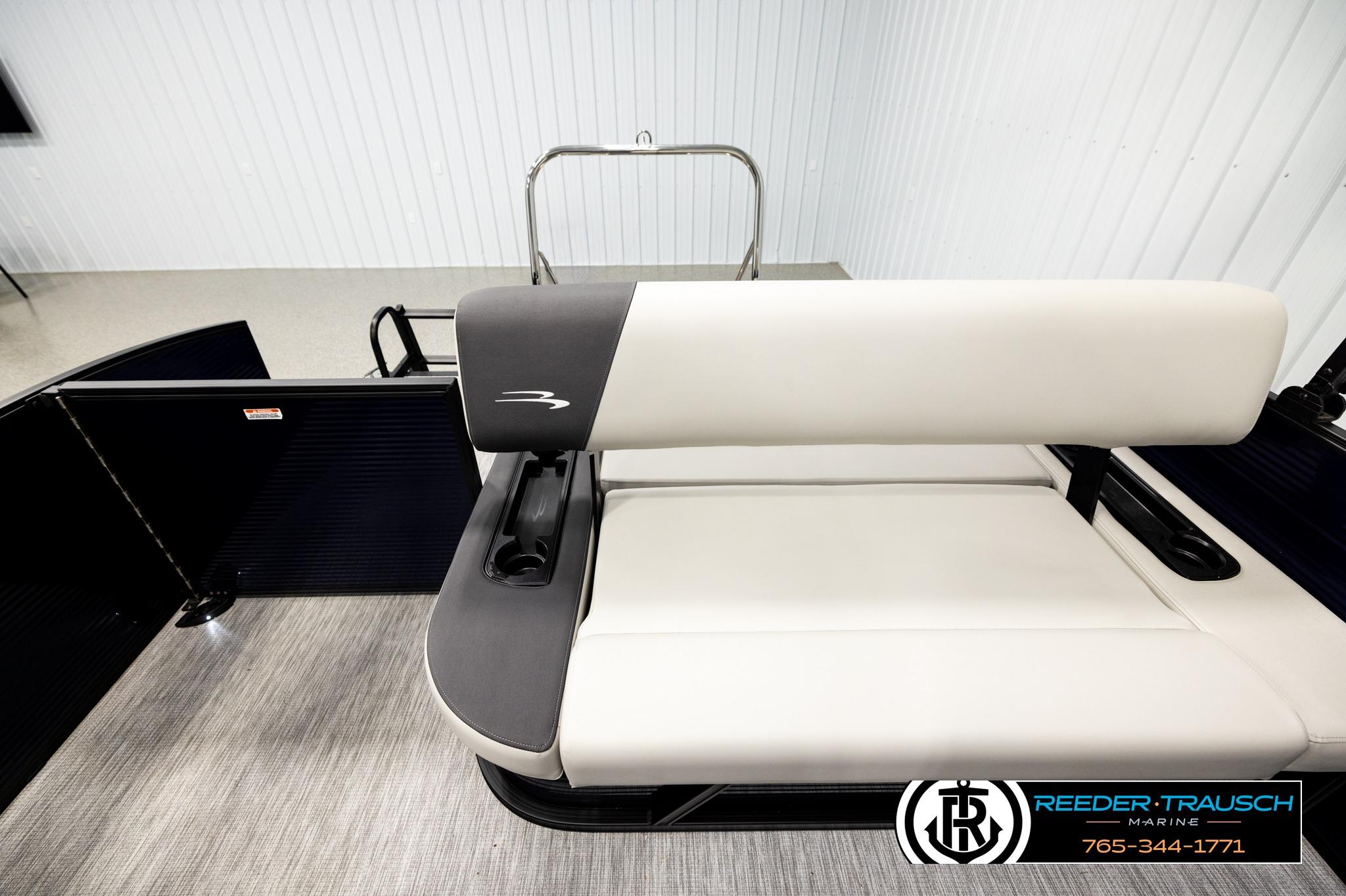 2026 Bennington 22 SSBSF boat interior with sleek seating design in showroom.