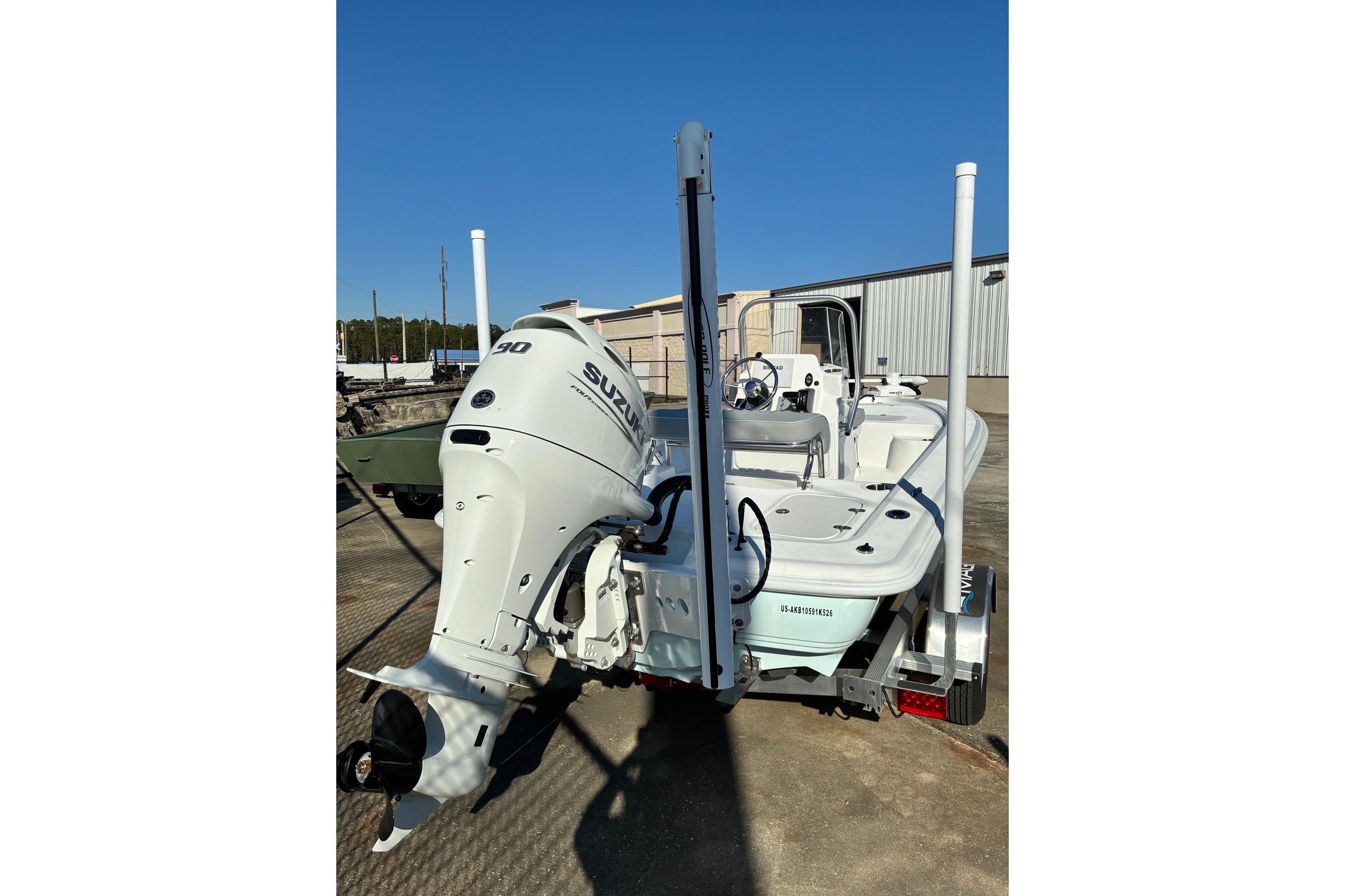 2026 ALK2 Powerboats 17HS with Suzuki outboard motor, parked outdoors.