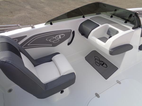 2024 Tahoe T21 boat interior with gray and white seating and dashboard.