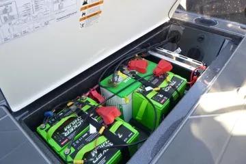 2026 Ranger 621FS Cup Equipped boat battery compartment with multiple green batteries.