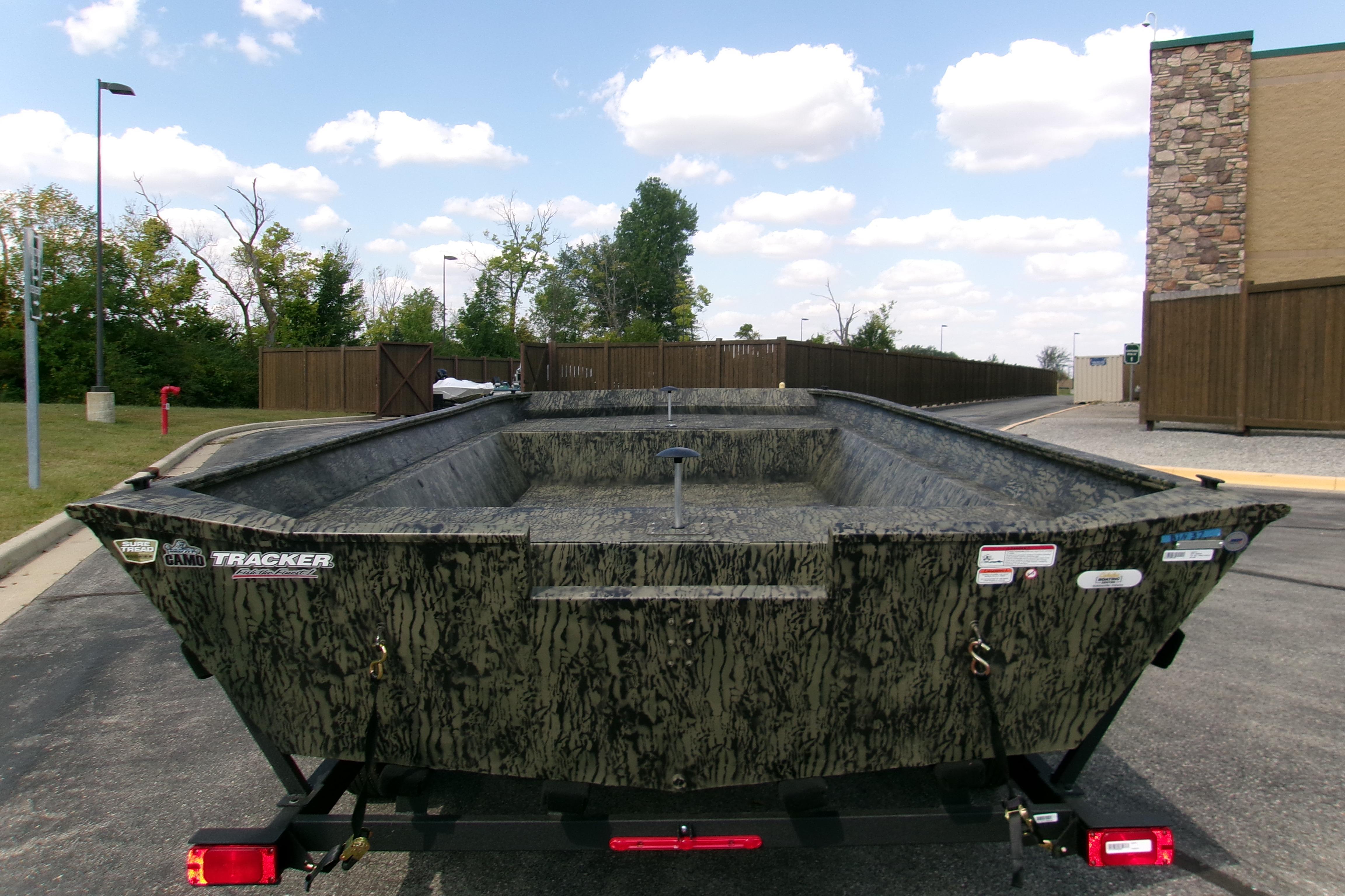 2026 Tracker Grizzly 2072 Utility boat with camouflage design on a trailer.