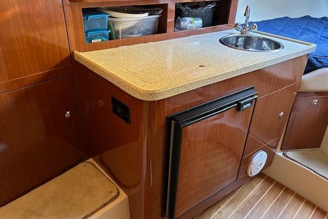 2010 Regal 3060 Window Express yacht interior with kitchenette and sink.