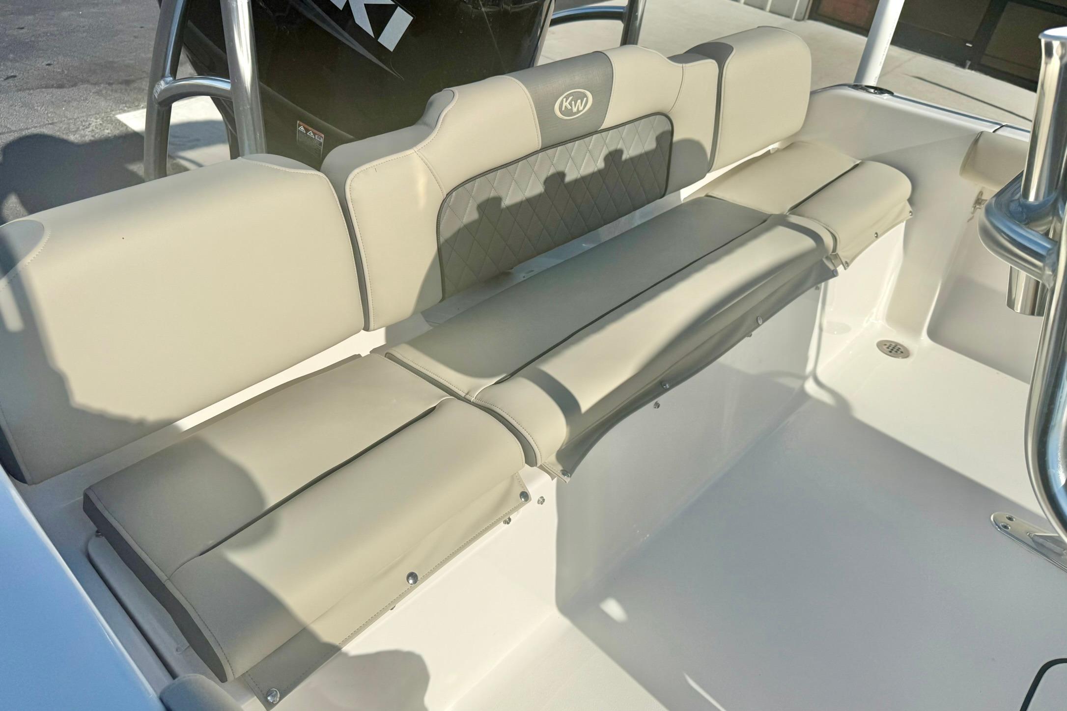2026 Key West 189 FS boat interior with beige cushioned seating.