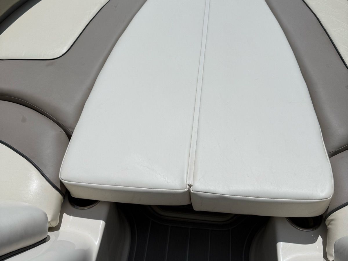 The image shows the cushioned sun deck of a 2007 Sea Ray 240 Sundeck boat.