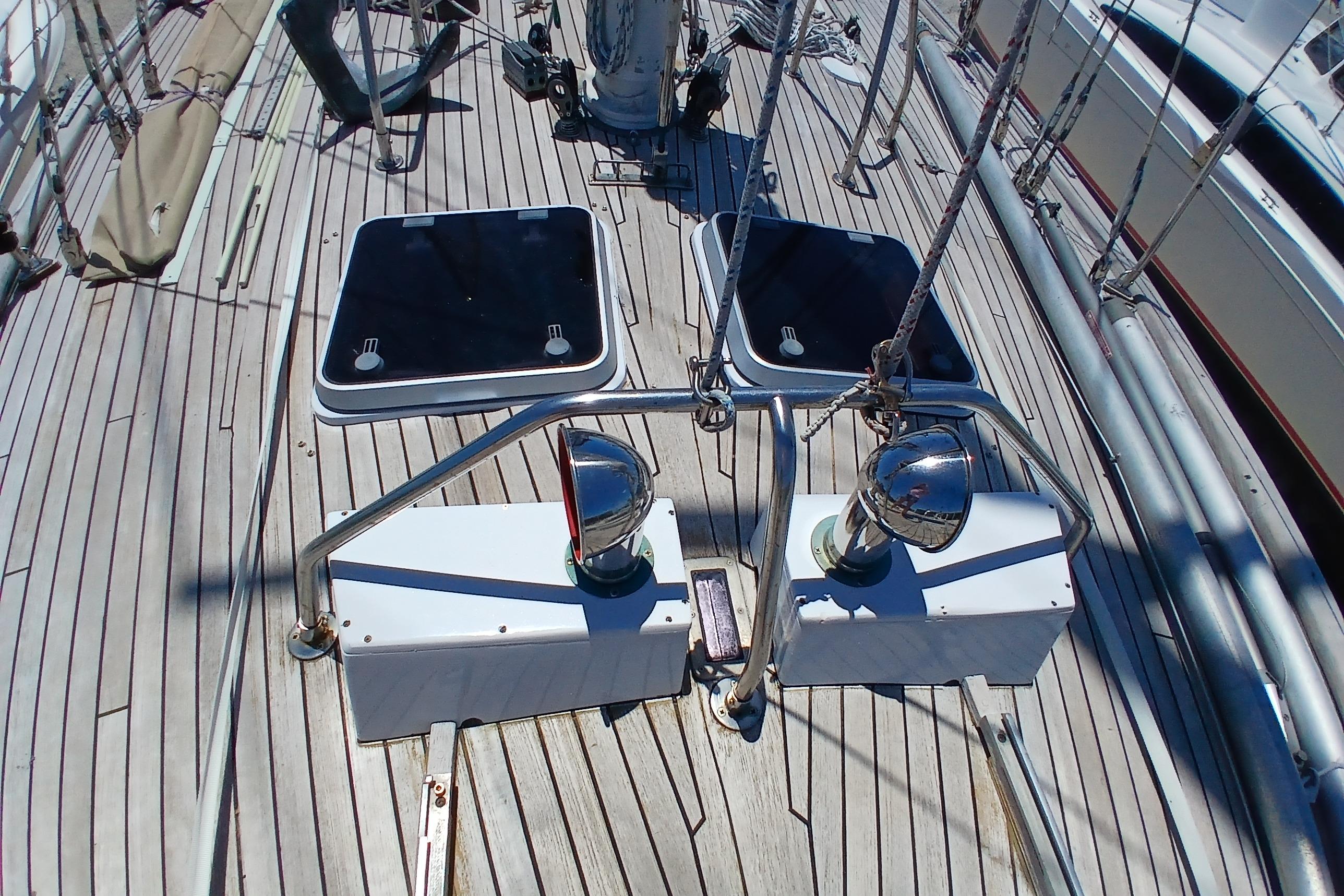 Deck of 1981 Kaufman Skye 51 sailboat with hatches and metal fittings.
