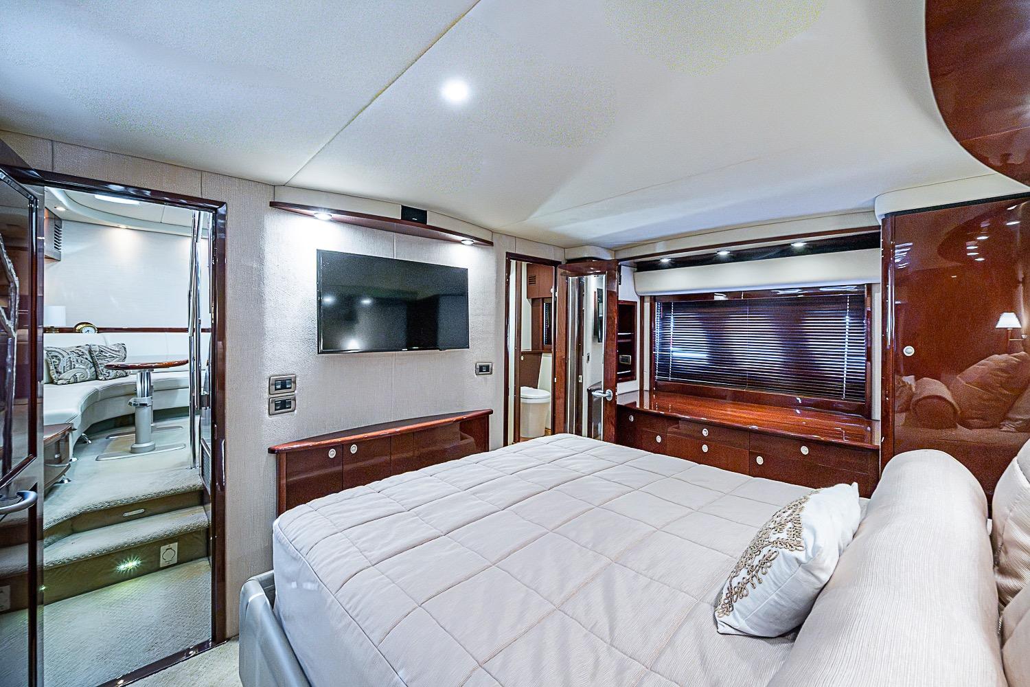 Luxurious interior of 2008 Sea Ray 60 Sundancer yacht with elegant bedroom and modern amenities.