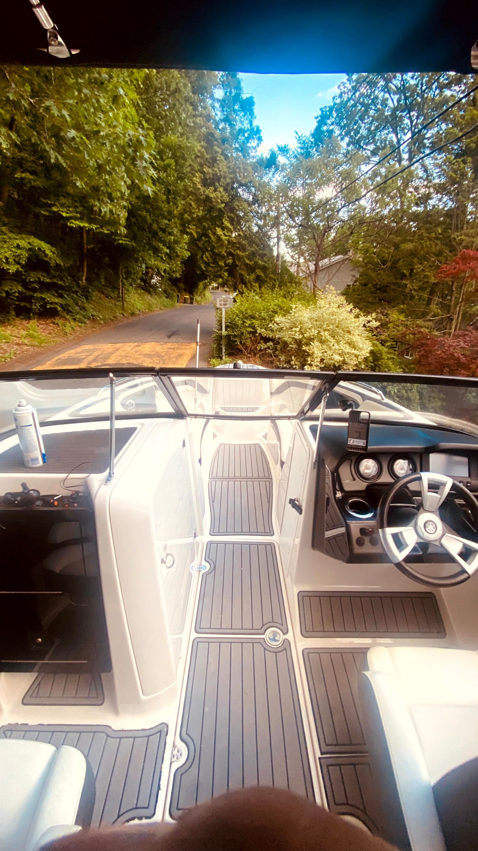 Interior view of a 2016 Yamaha AR240 boat on a road.