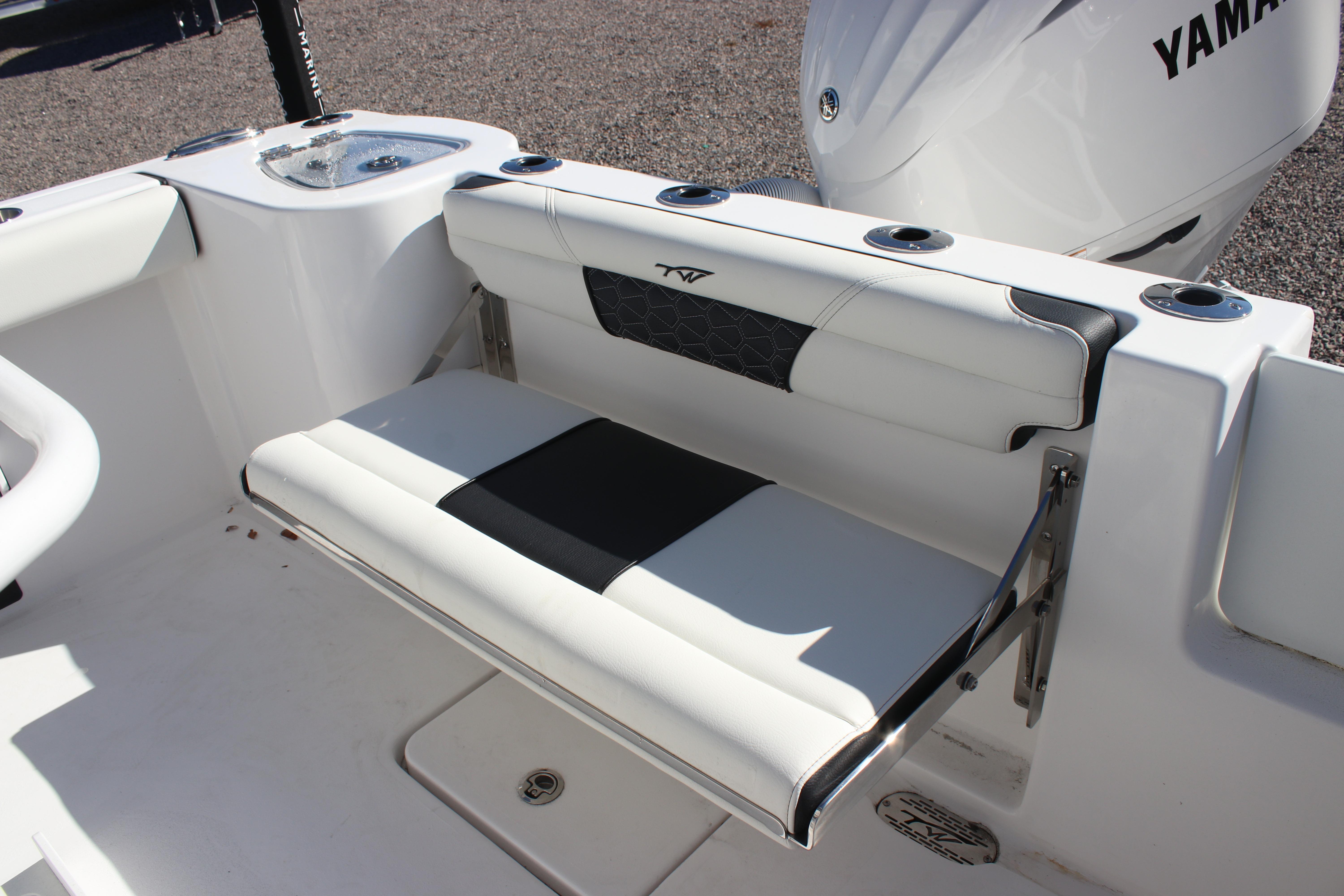 2026 Tidewater 232 CC Adventure boat with white seating and Yamaha engine.