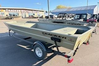 2026 Tracker Grizzly 1860 Utility boat on trailer at dealership.