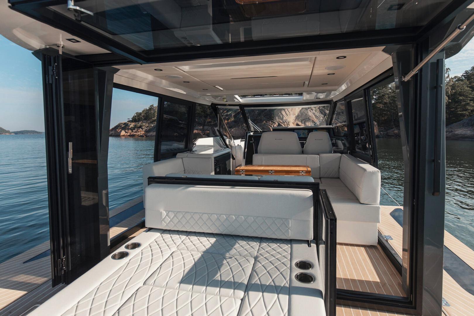 Luxurious interior of 2026 Saxdor 400 GTC yacht with elegant seating and scenic water view.