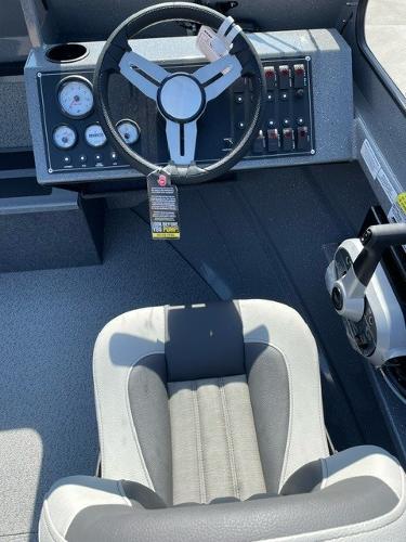 2025 Spartan 185 Astoria boat interior with steering wheel and control panel.