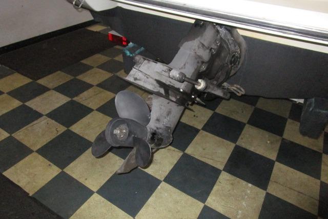 2004 Stingray 240 LR boat propeller on checkered floor background.