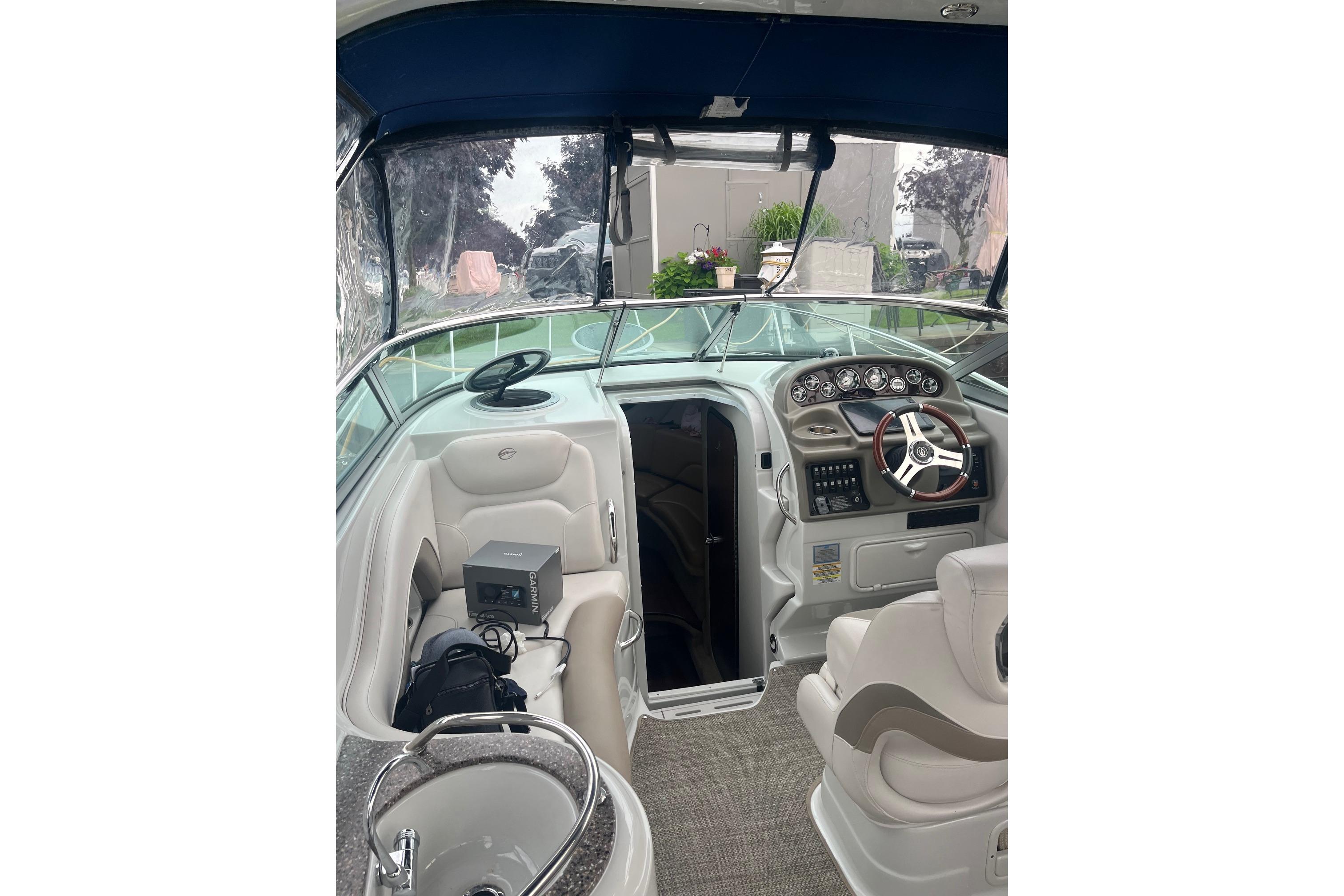 2016 Crownline 264 CR boat interior with steering wheel and seating area.