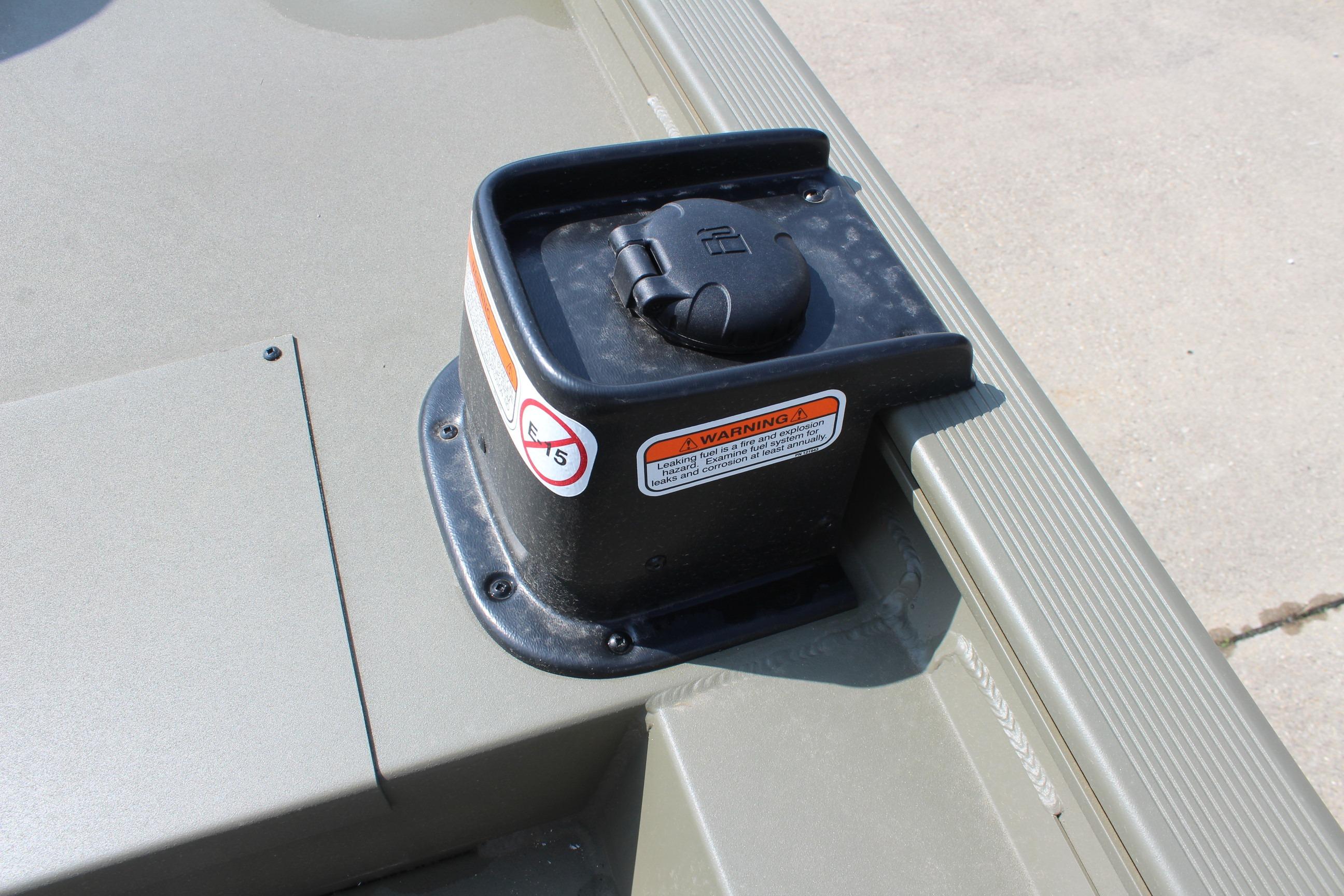 Fuel cap on 2026 Tracker Grizzly 1754 SC boat, featuring safety warning labels.