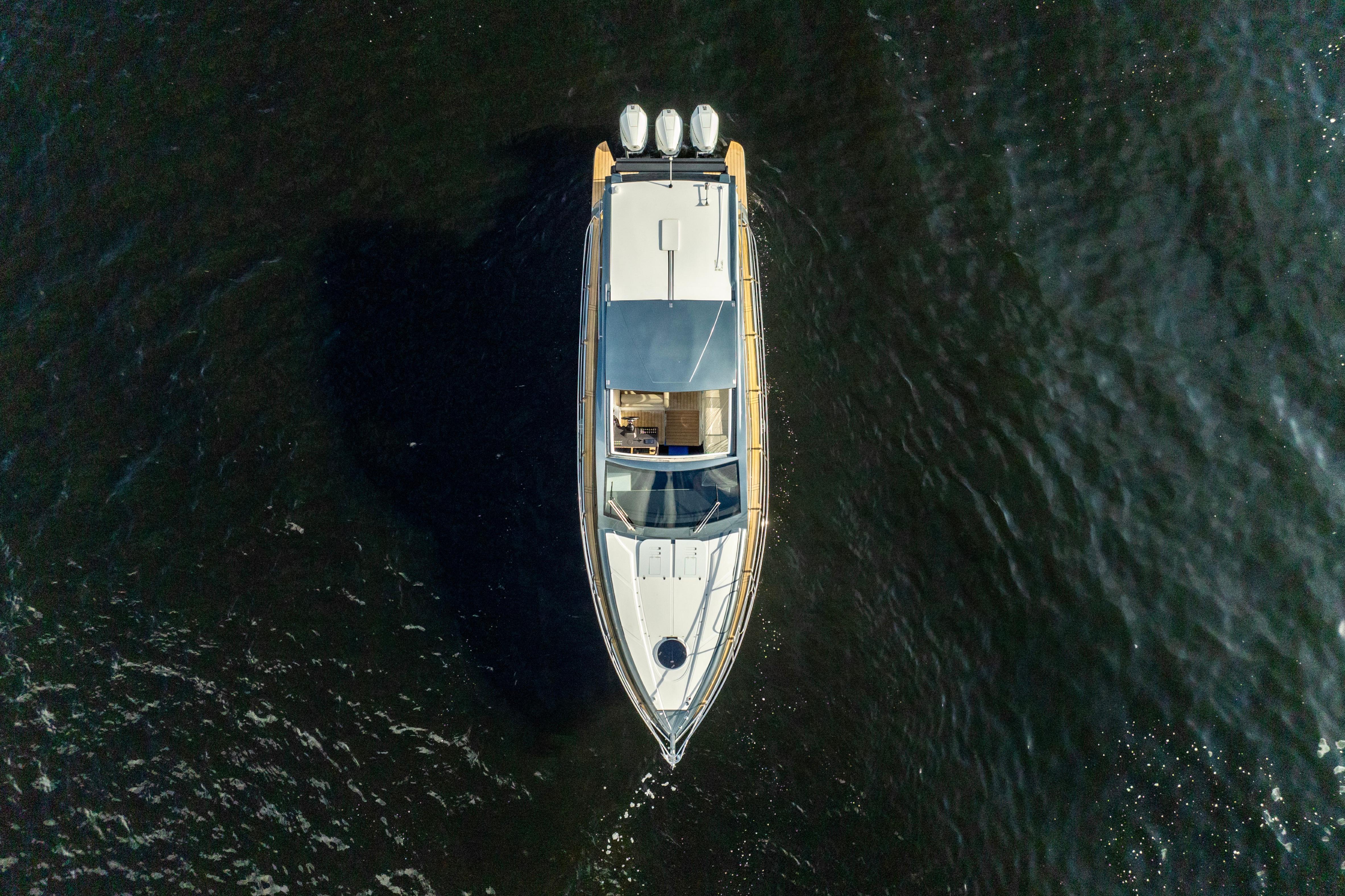 Top view of 2025 Valiatt 410HT yacht cruising on dark water.