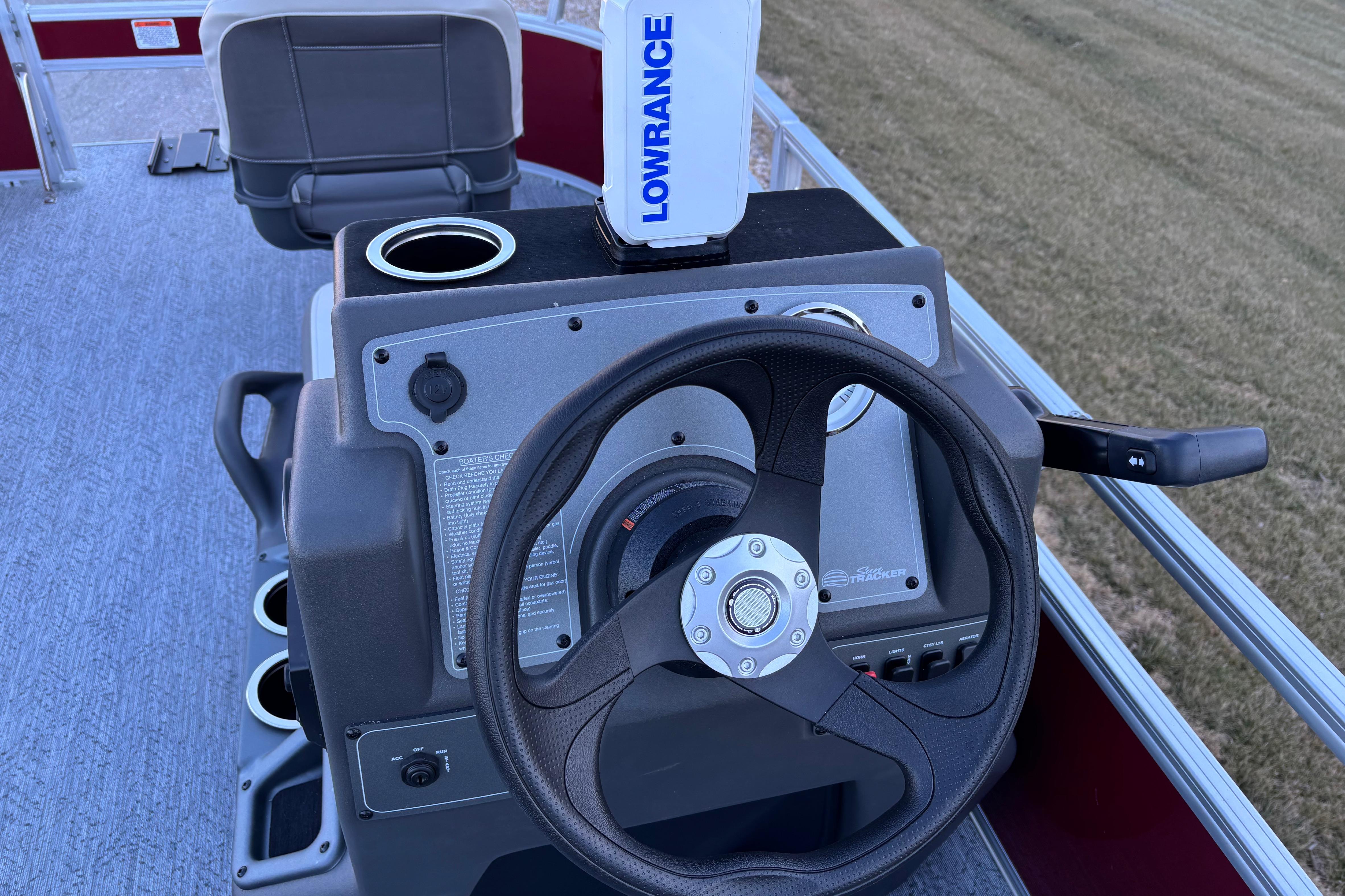 2026 Sun Tracker Bass Buggy 16 XL Select steering console with Lowrance device.