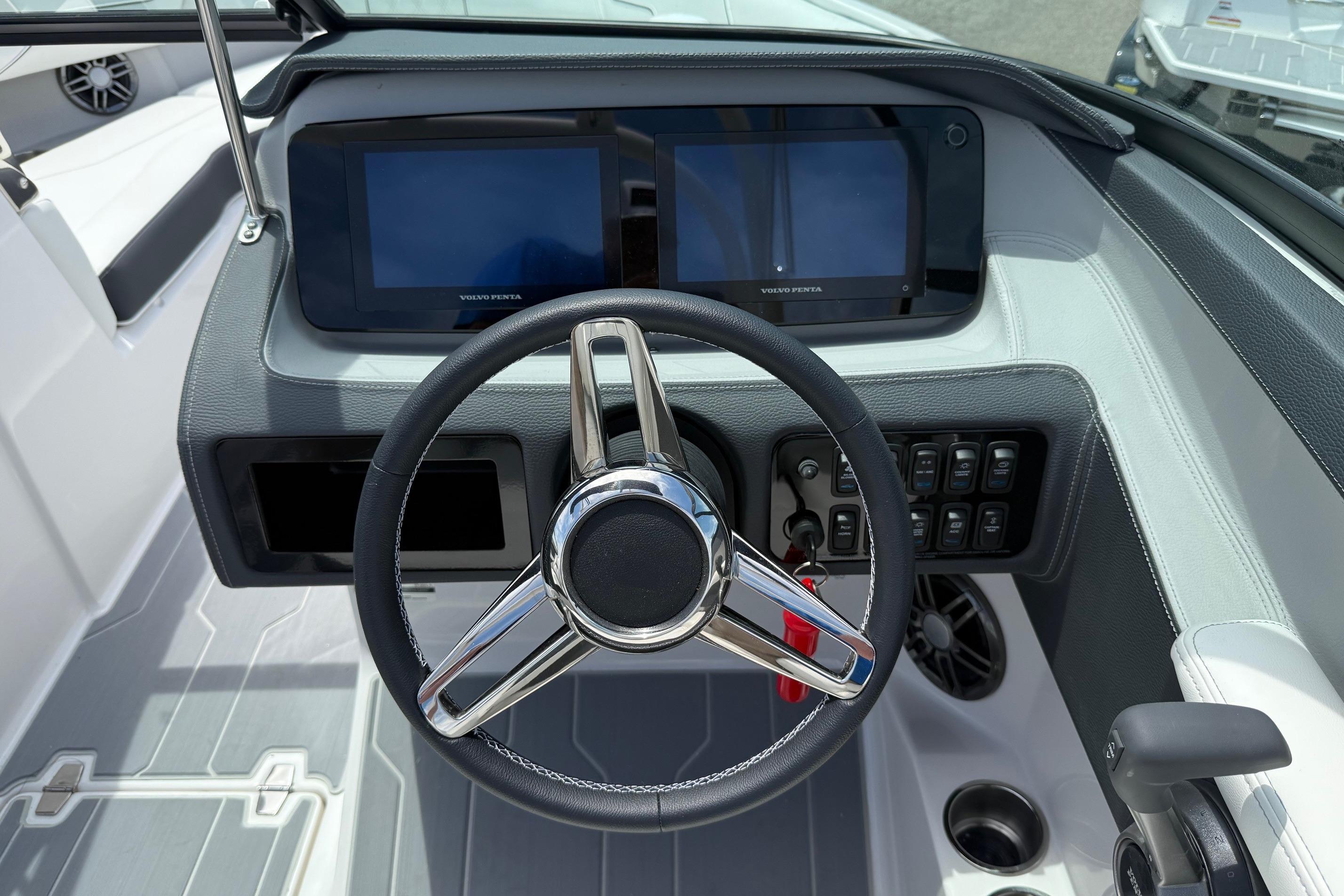 2026 Regal LS4 Surf boat dashboard with dual screens and modern steering wheel.