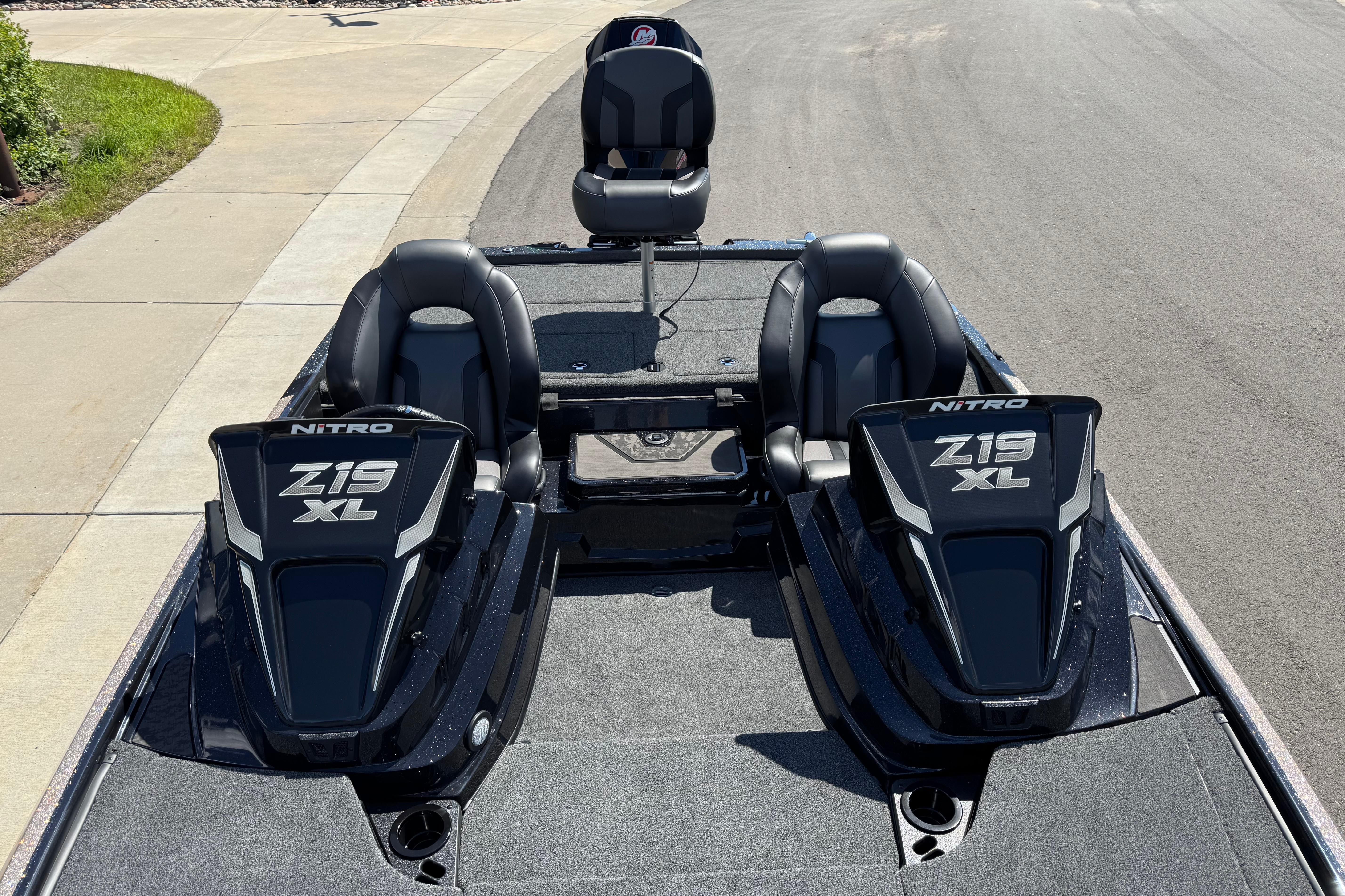 2026 Nitro Z19 XL boat with dual seats and sleek design on a paved surface.