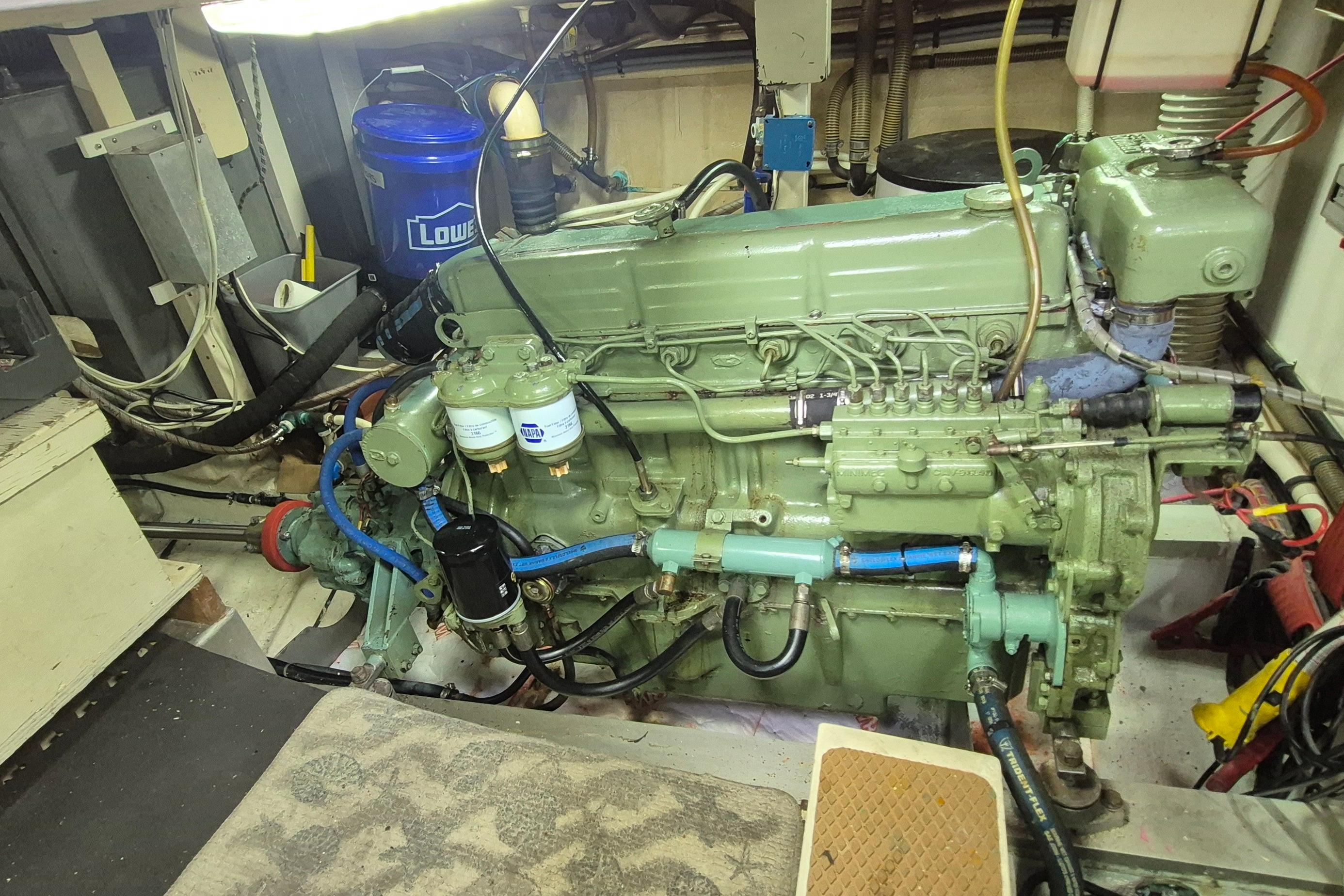 Engine room of a 1983 Grand Banks 42 Motoryacht, showcasing a well-maintained marine engine.