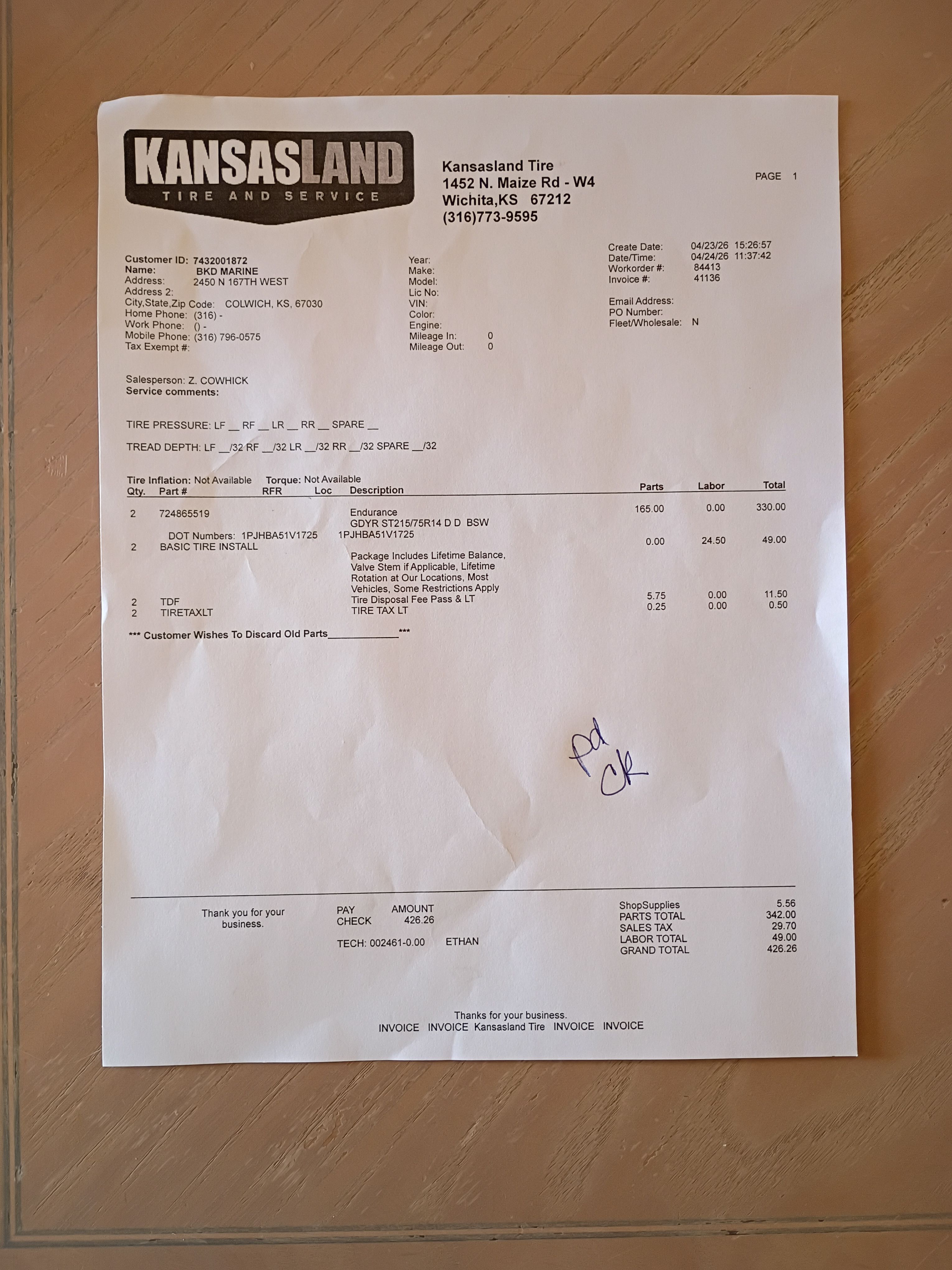 Kansasland Tire invoice for tire services, dated 03/24/23.