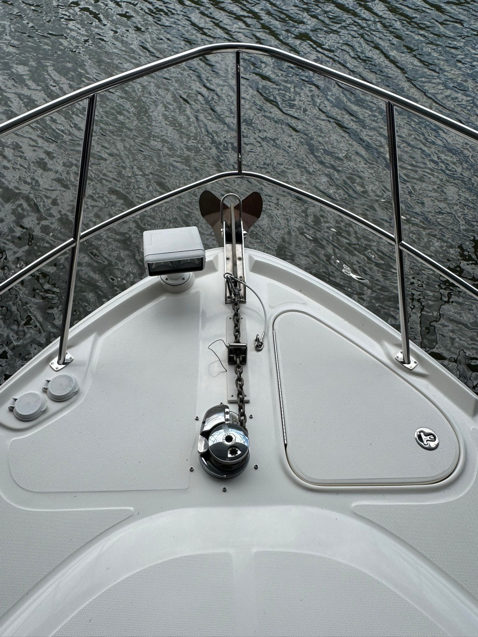 Bow of a Sea Ray 40 Sundancer boat on the water.