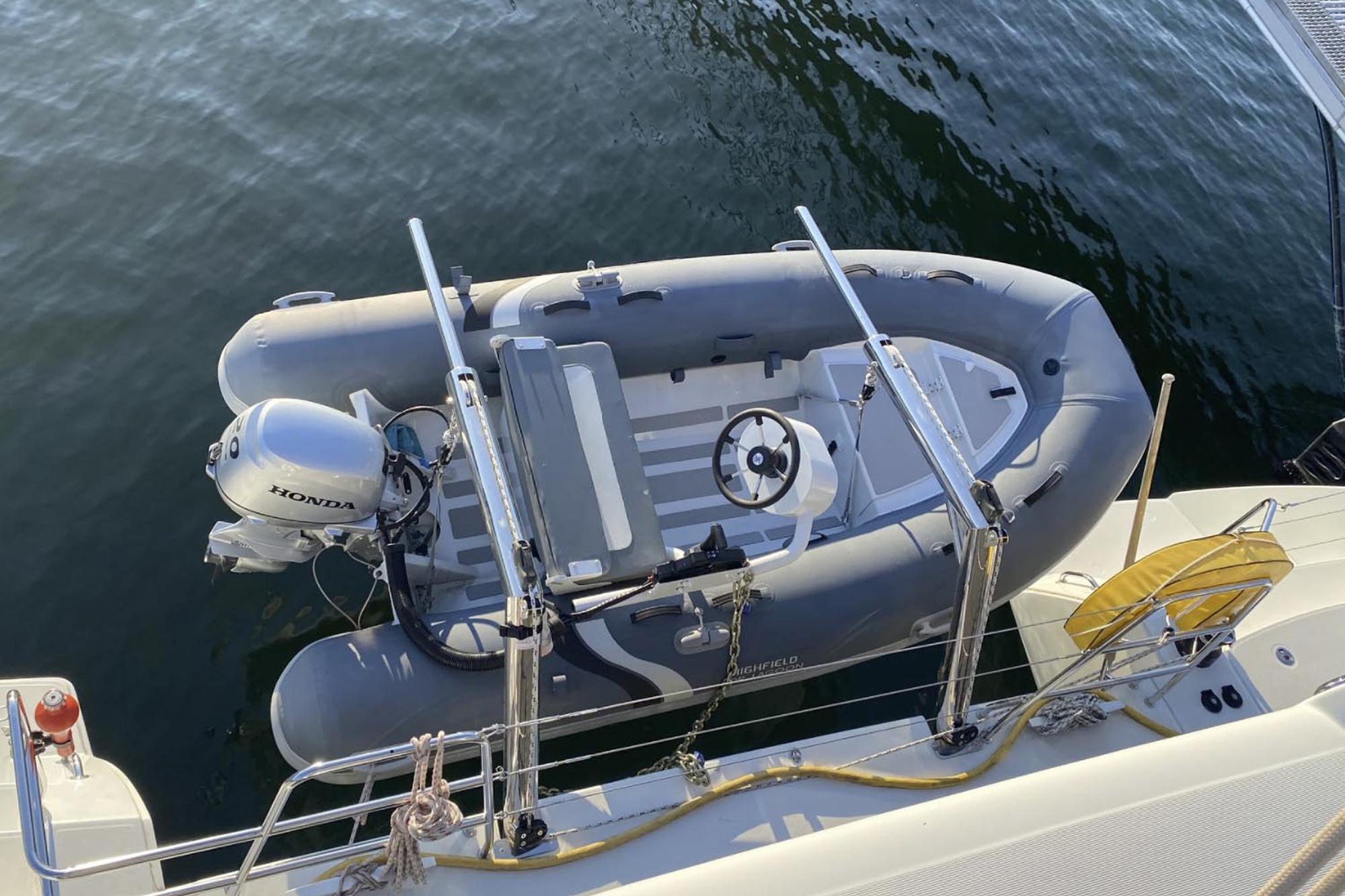 Inflatable dinghy with Honda motor on Lagoon 450 F catamaran, 2019 model.