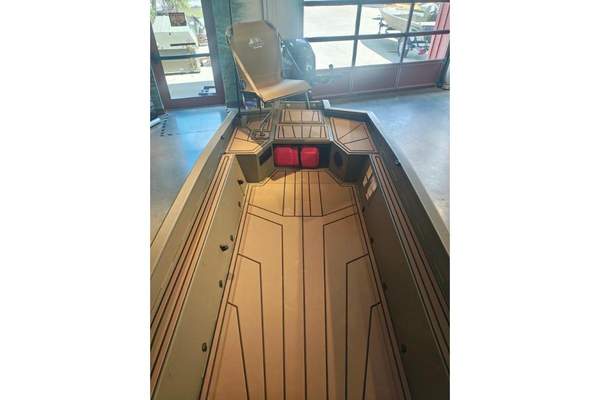 2026 Tracker Grizzly 1650 T Prairie Wings Edition boat interior with seating and storage.