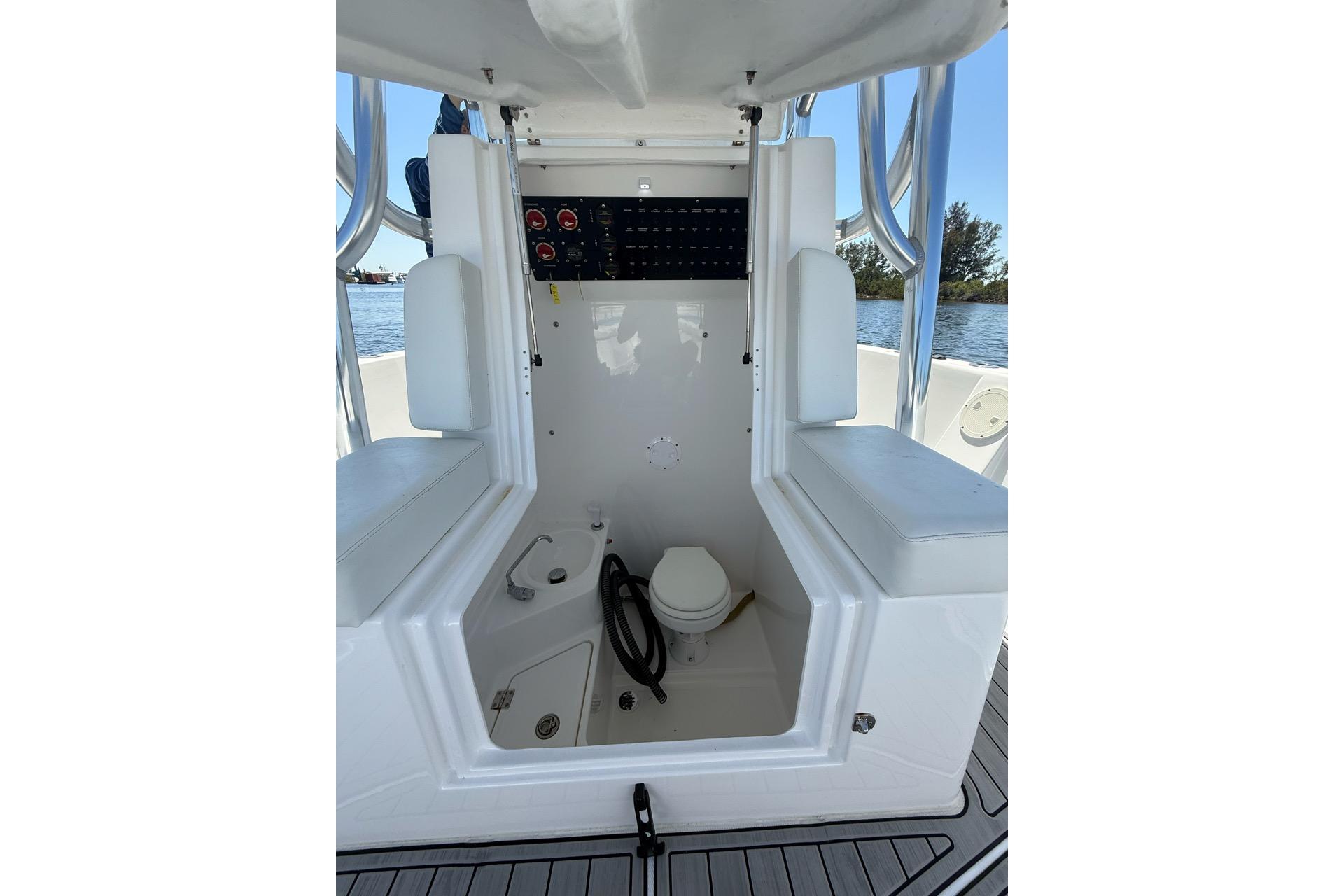 2021 Custom Infusion 34 CC boat interior with seating and control panel.