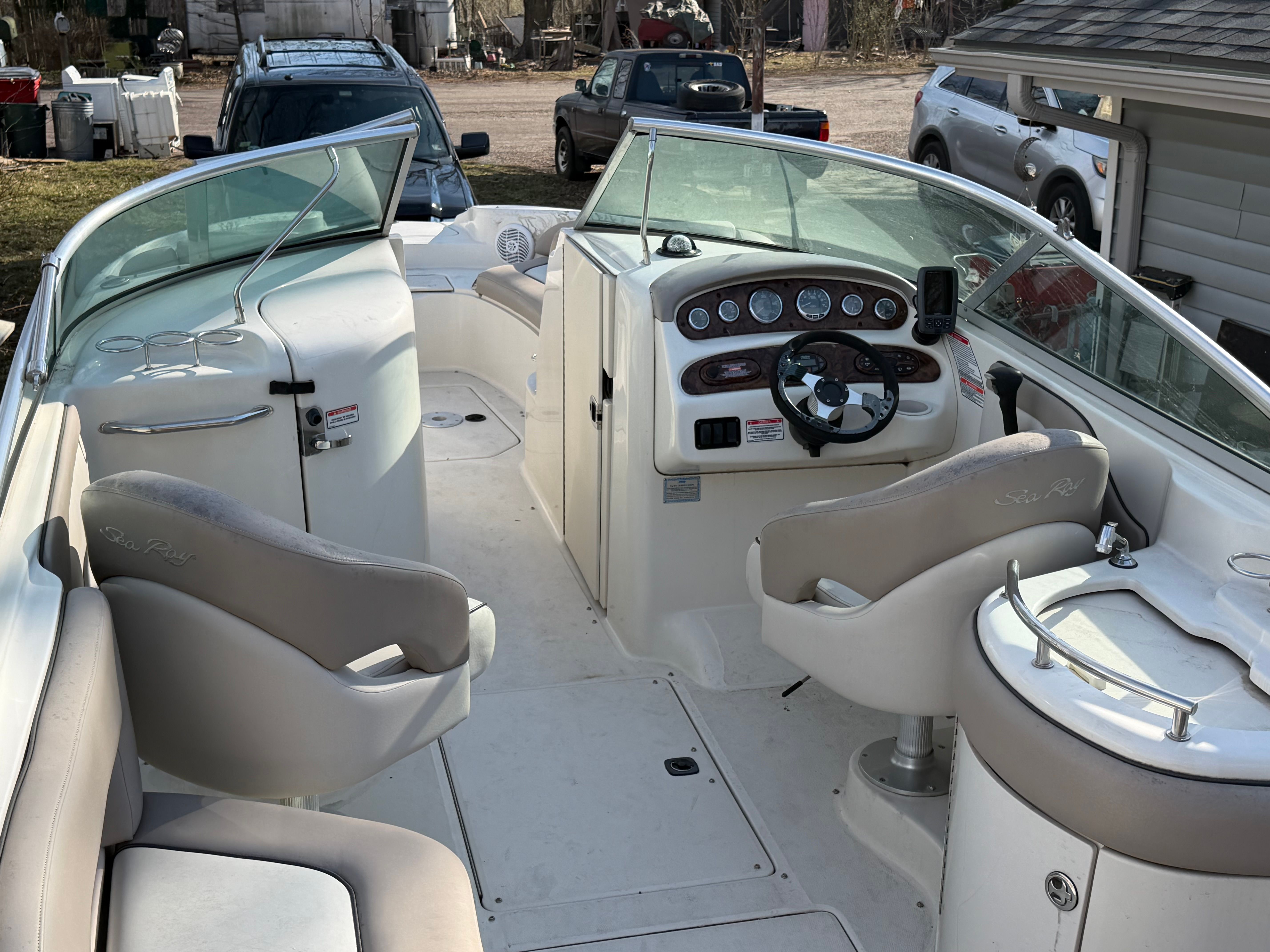 Interior of a 2004 Sea Ray 270 Sundeck boat with helm station.
