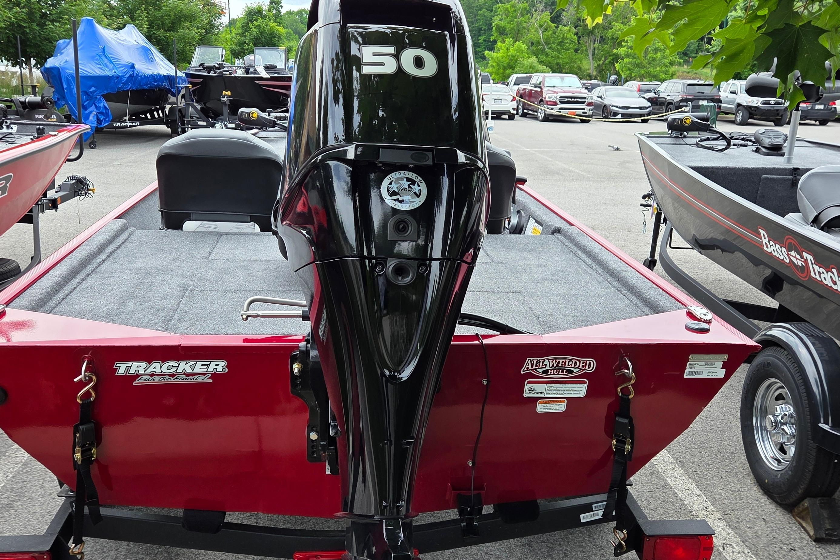 2026 Tracker Bass Tracker Classic XL boat with 50 HP engine in parking lot.