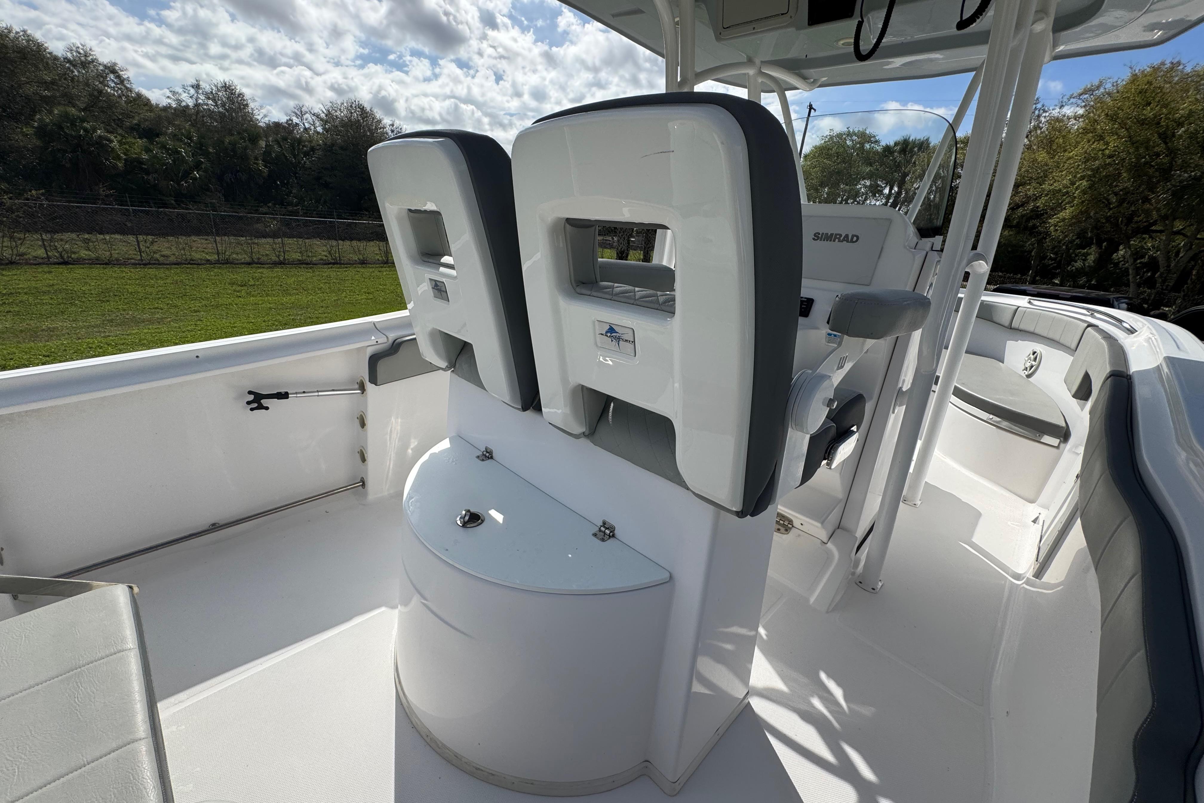 2022 Aquasport 2500 Center Console boat interior with seating and console features.
