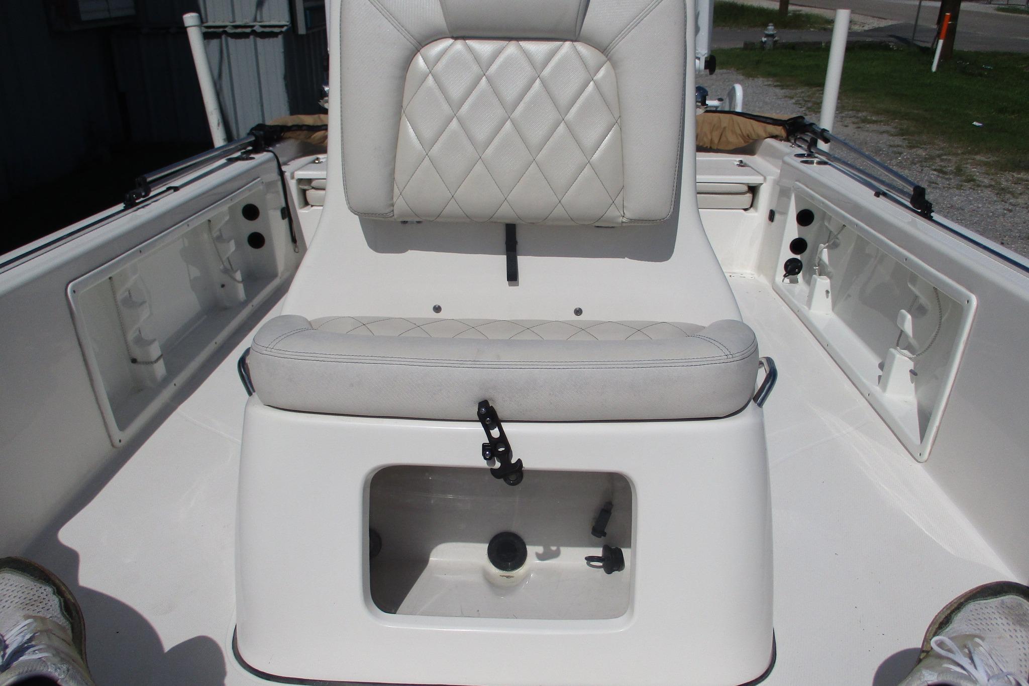 2021 Blue Wave 2000 PureBay boat interior with cushioned seating and storage compartments.