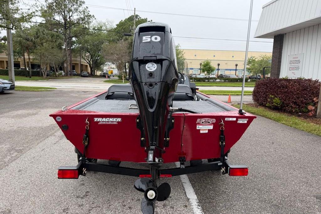 2026 Tracker Bass Tracker Classic XL boat with a 50 HP outboard motor, parked outdoors.