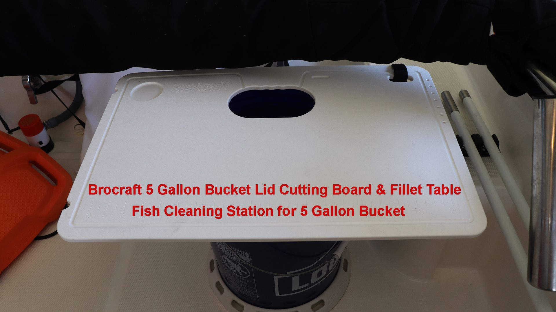 Cutting board and fillet table on a 5-gallon bucket.
