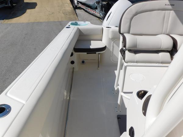 2024 Sailfish 242 CC boat interior with cushioned seating and storage compartments.