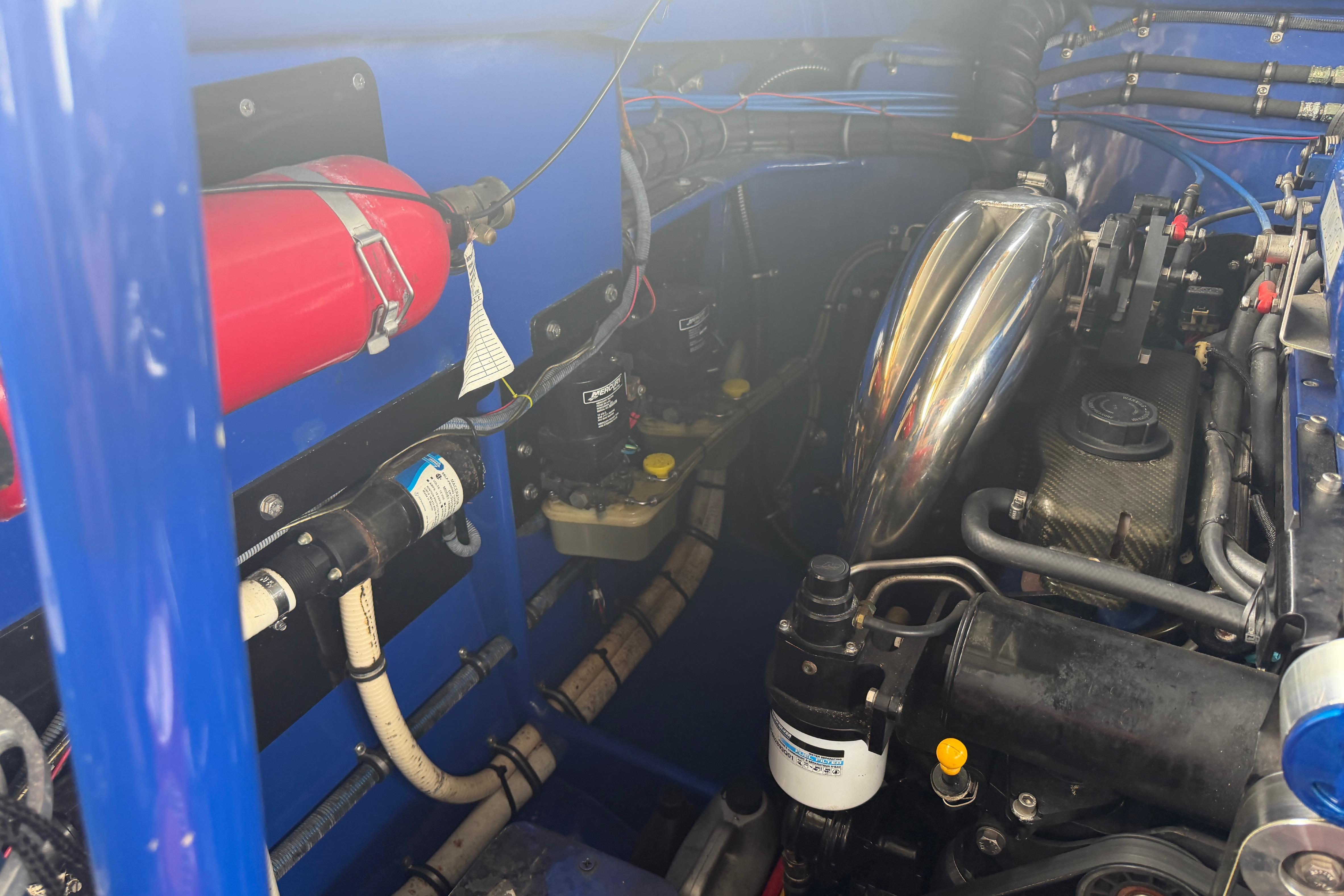 Engine compartment of a 2013 Nor-Tech 477 SPX Vee Bottom boat, showcasing mechanical components.